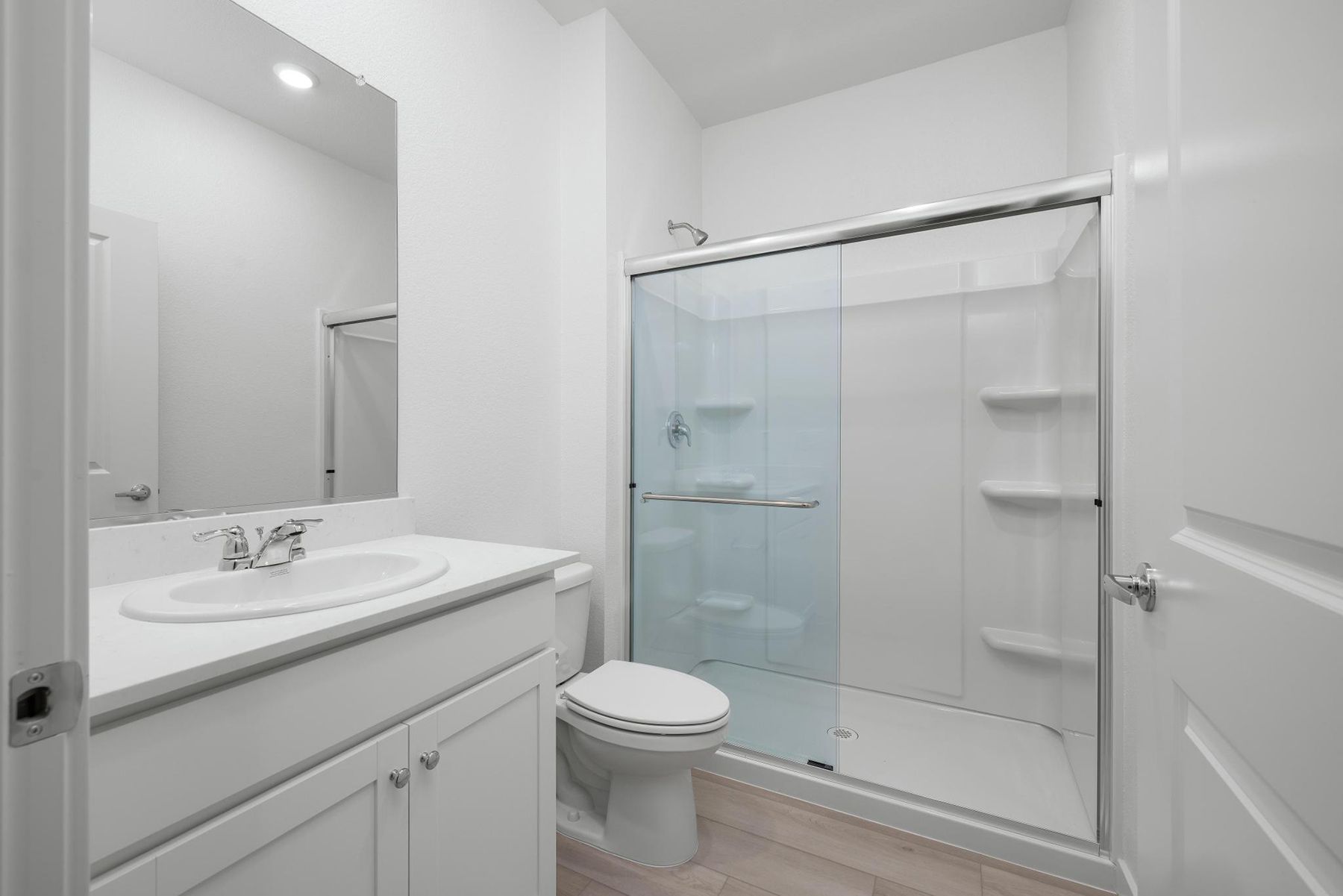 The secondary bedroom has a step in shower.