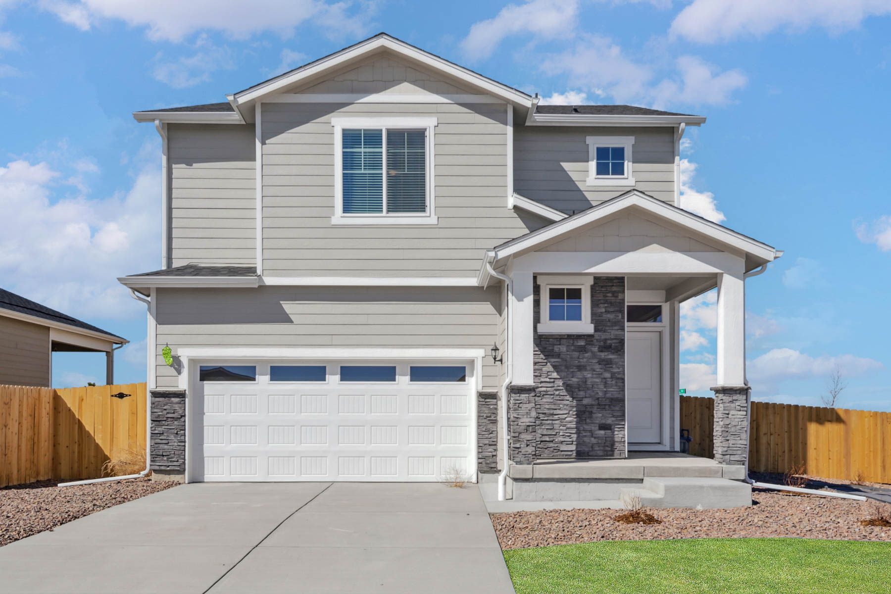 The Peak is a beautiful two-story, five-bedroom home with siding.