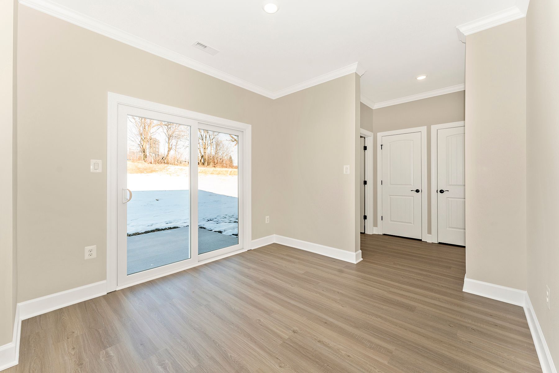 The dining area opens to the backyard