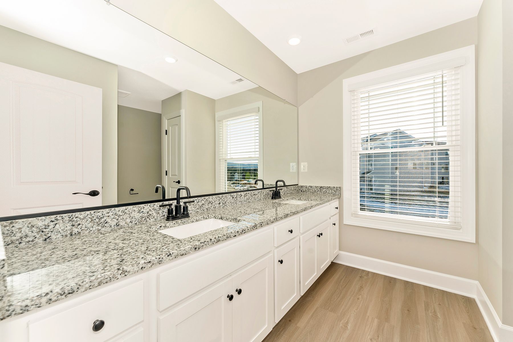 The master bathroom has granite countertops