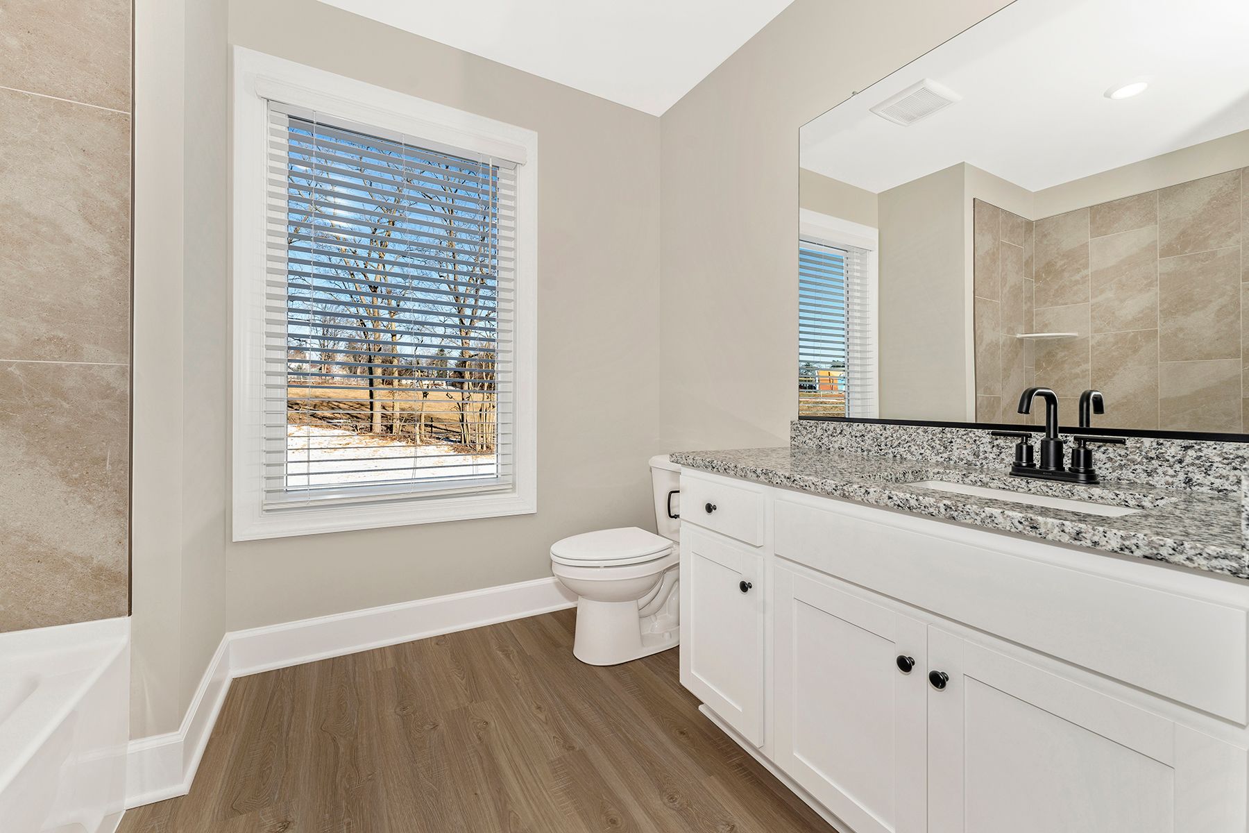The master bedroom has plenty of size for your king-sized furniture
