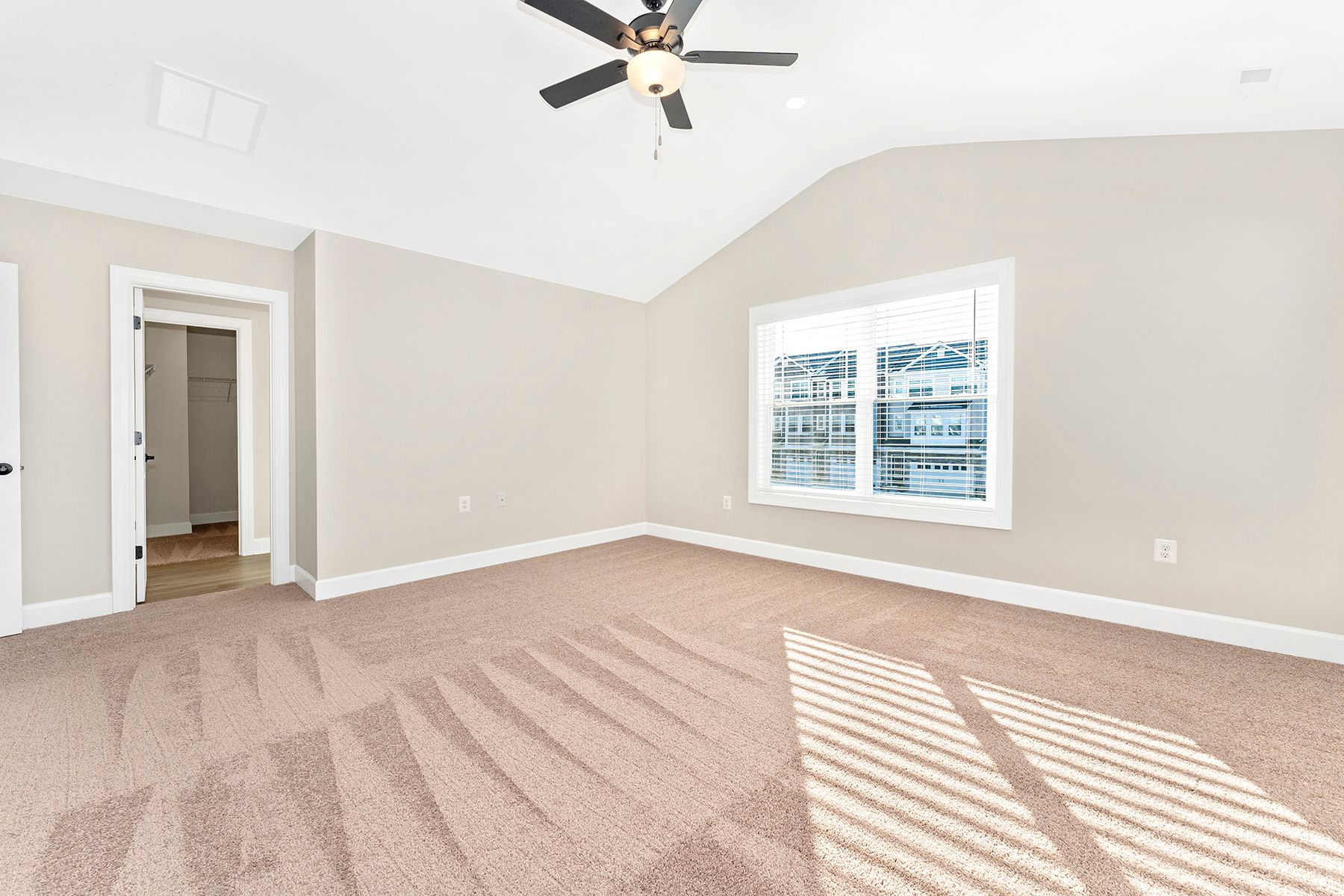 The master bedroom has lots of windows to let in natural light