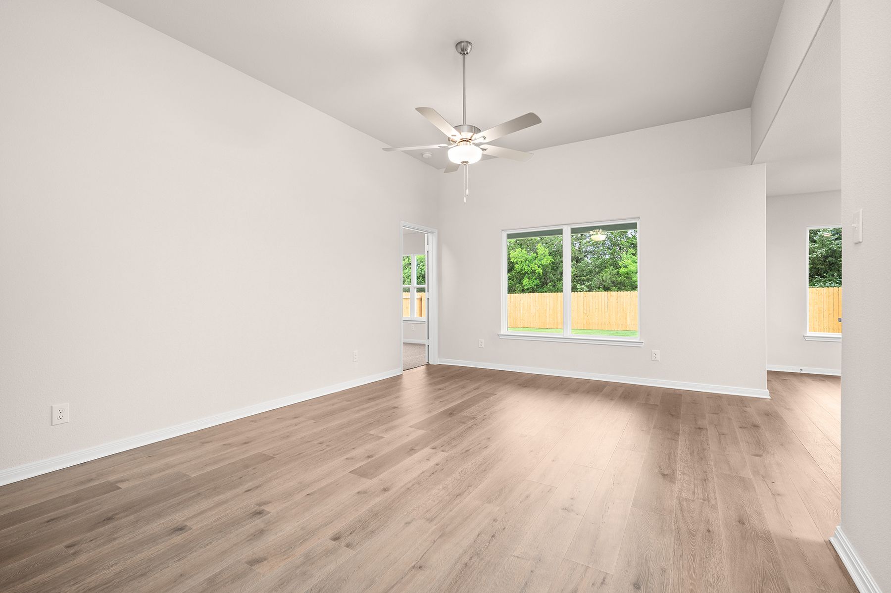 The family room has a large window that lets in great, natural light.