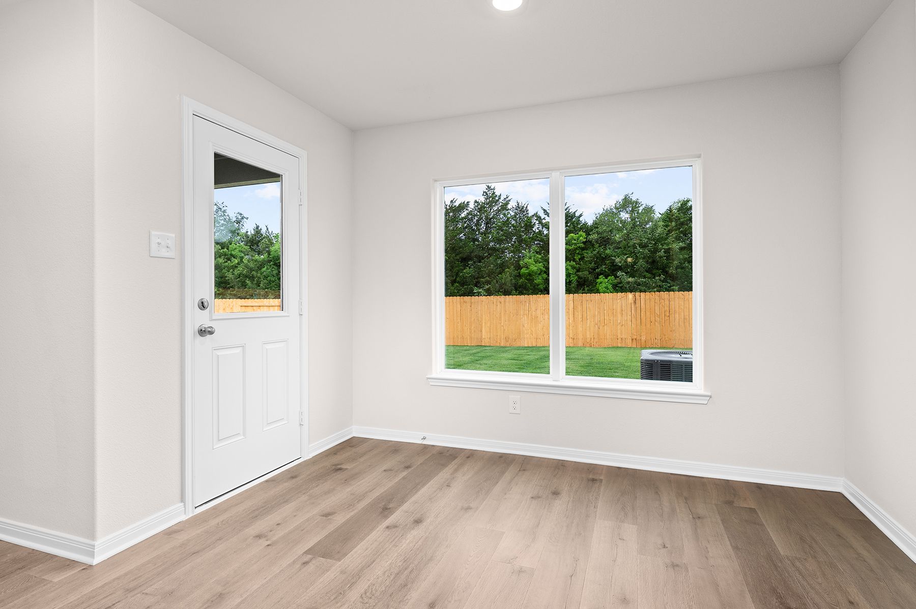 The dining room has a large window that lets in great, natural light.