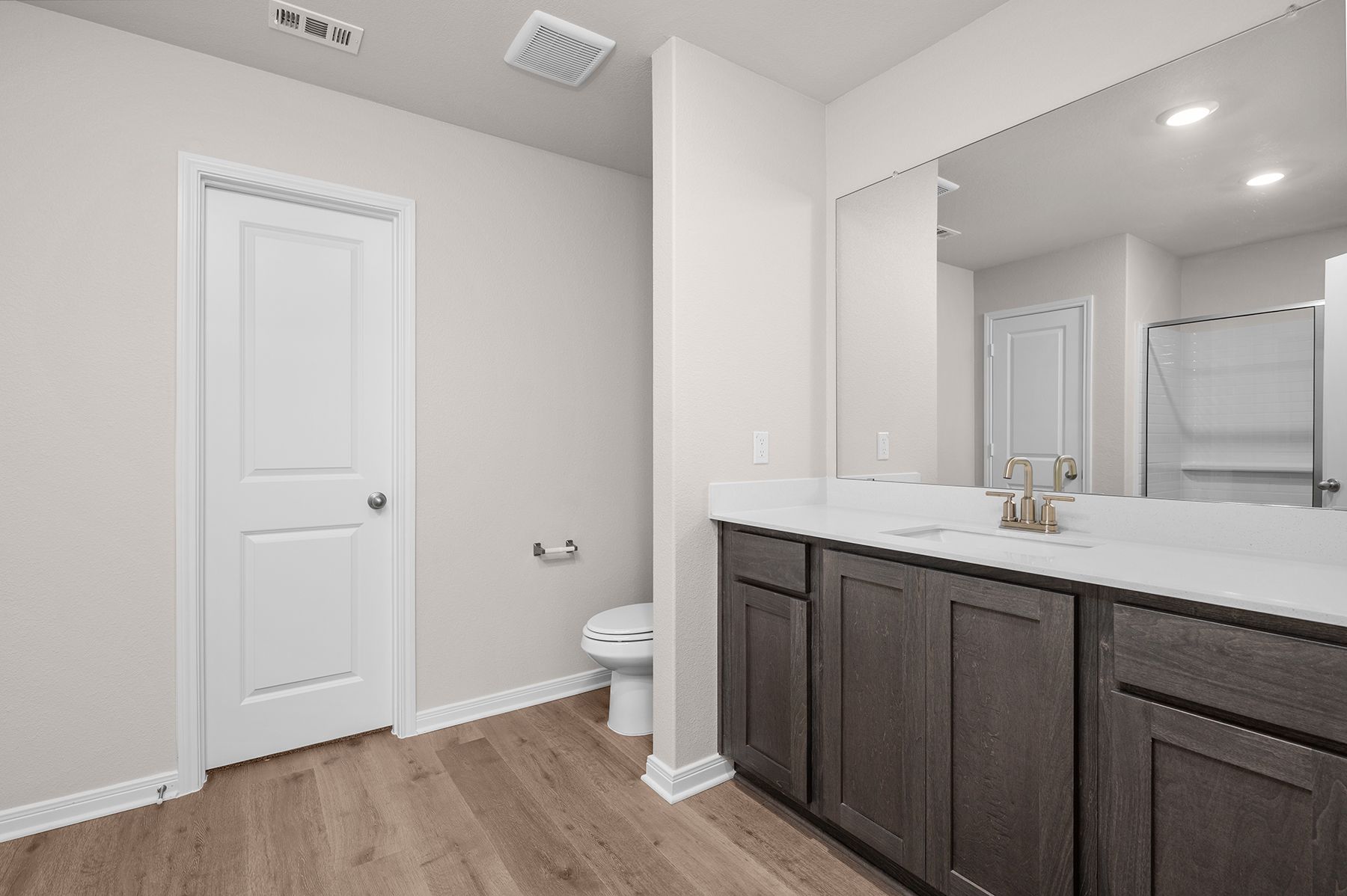 The master bathroom has a large vanity space.