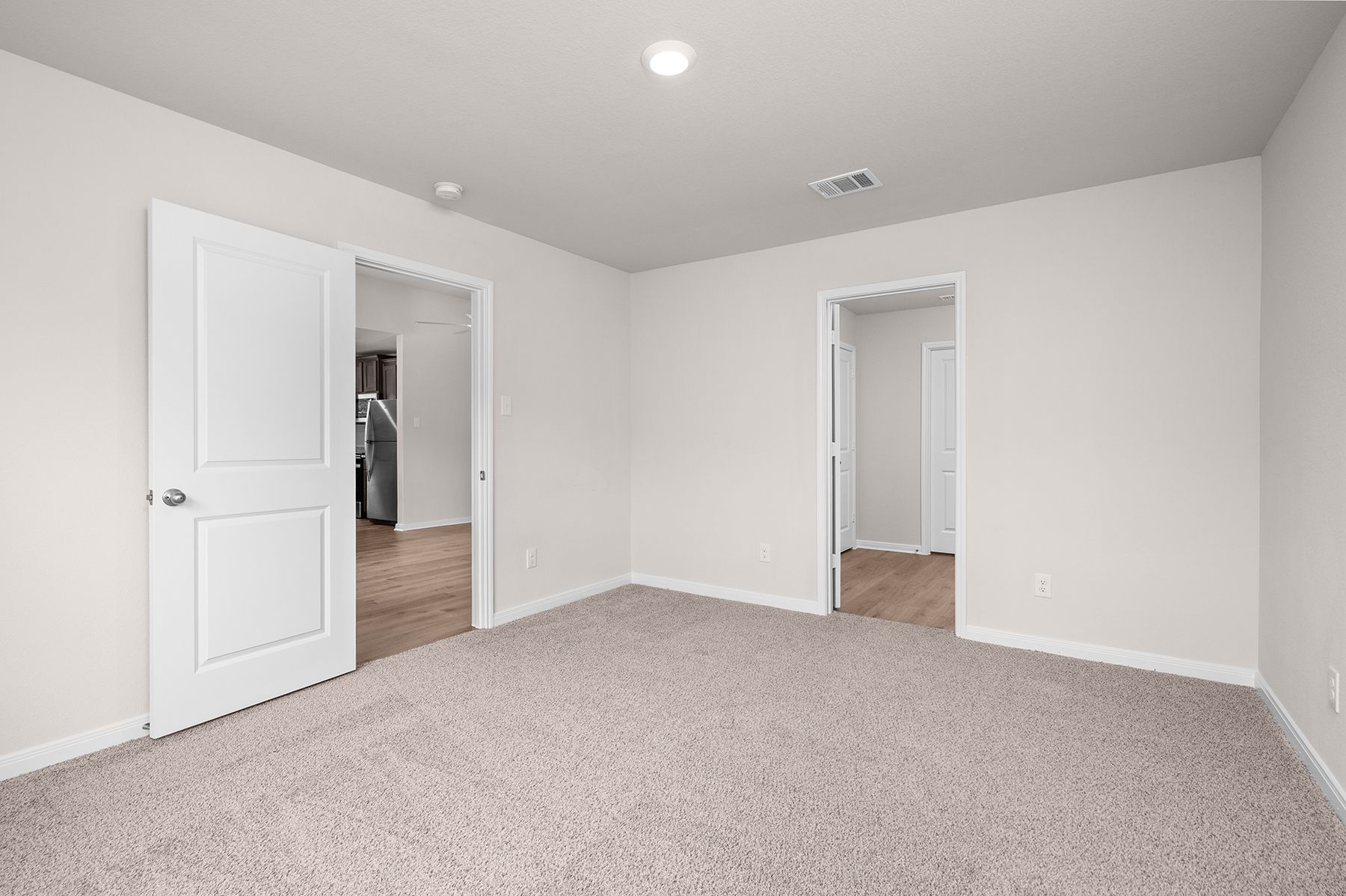 The master suite has a large bedroom, ensuite bathroom and walk-in closet.