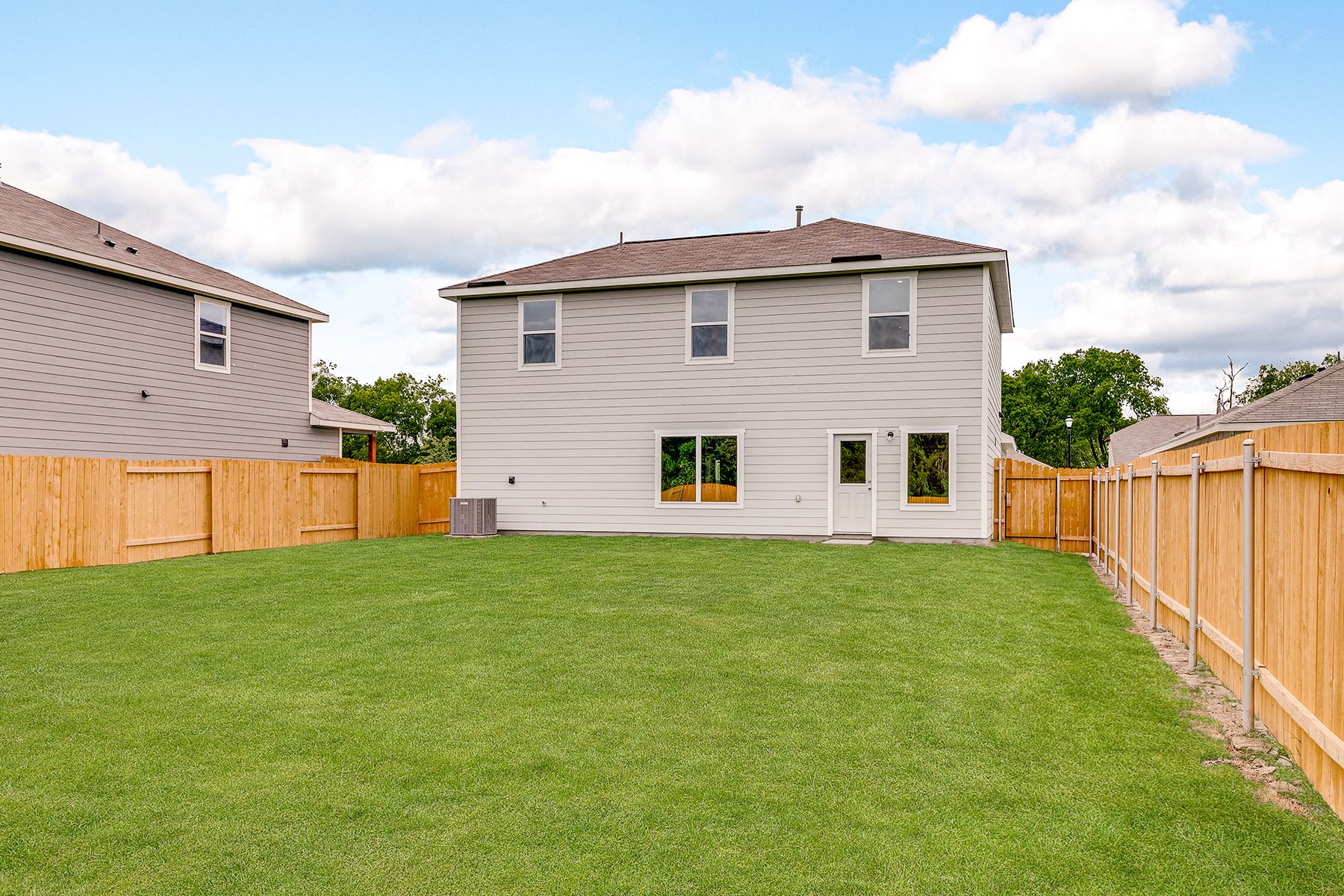 The back yard of the Cypress is fully fenced in.
