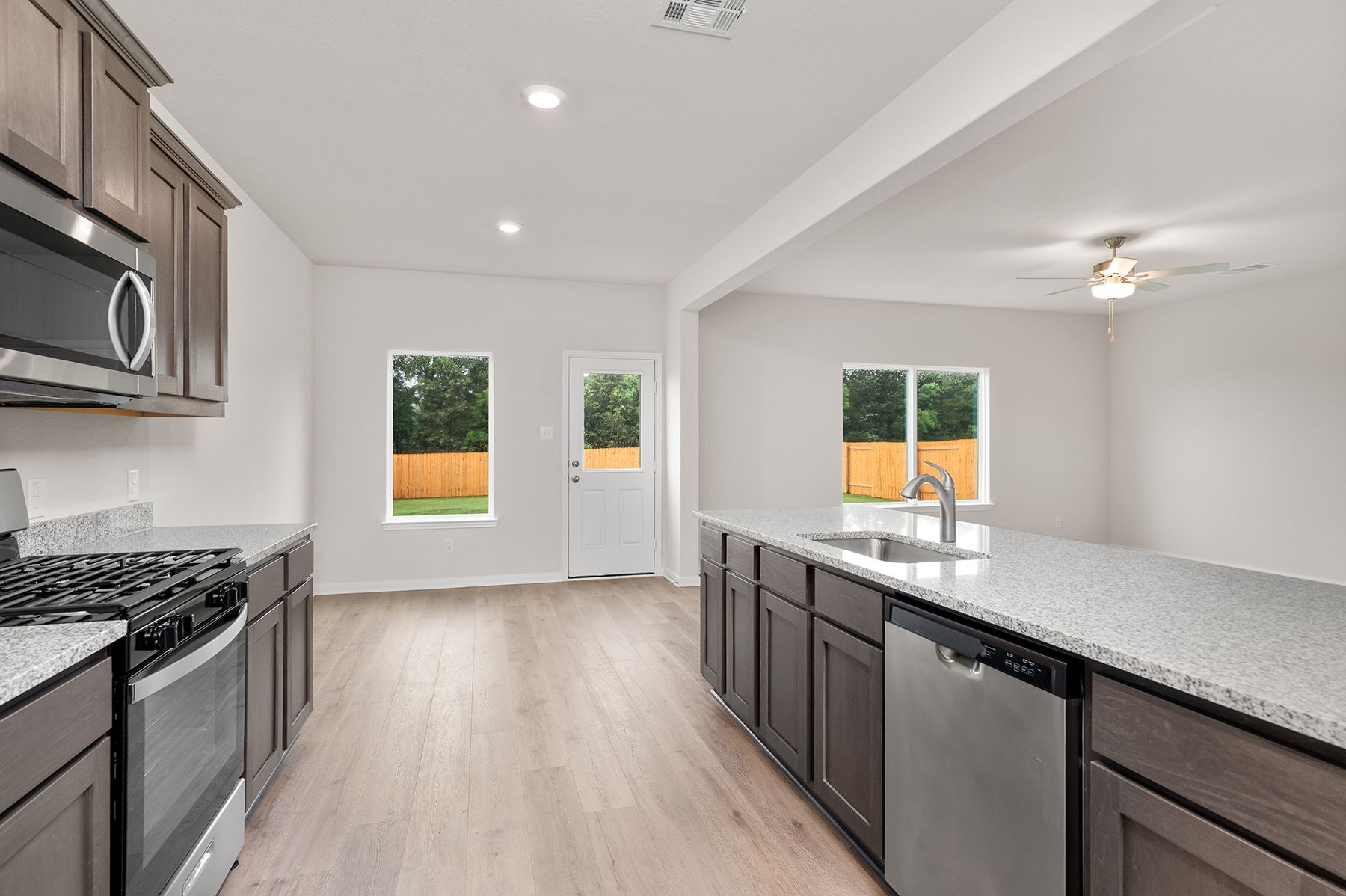 The kitchen of the Cypress has sprawling granite countertops.