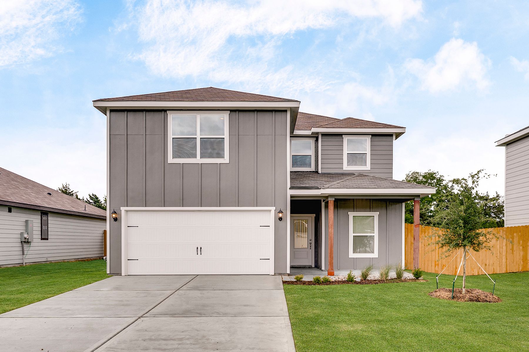 The two-story Driftwood plan is a beautiful siding home.