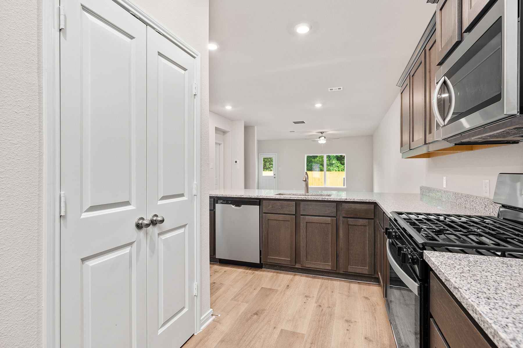 The kitchen of the Driftwood has stainless-steel appliances.