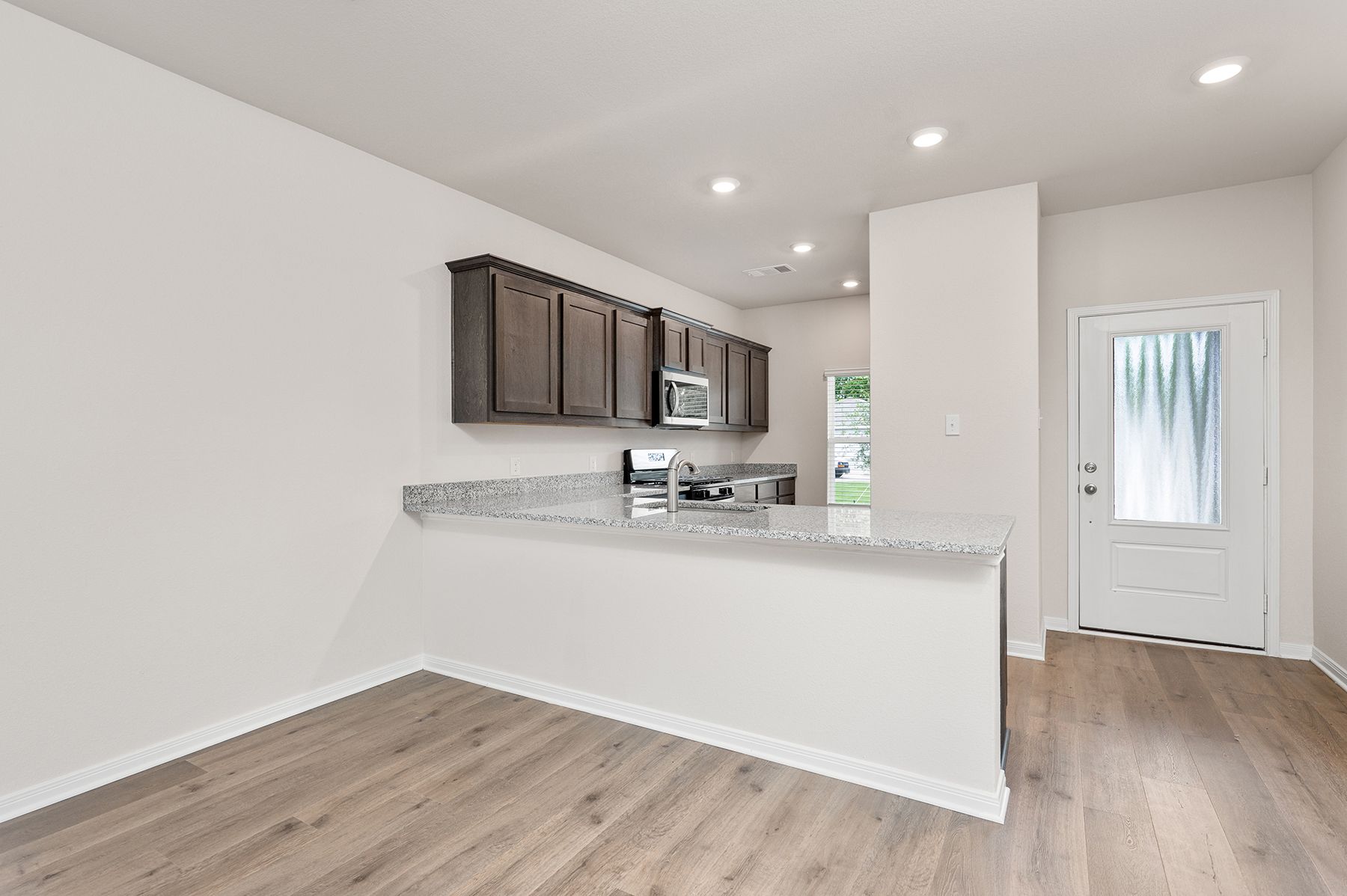 The kitchen of the Driftwood has beautiful granite cabinetry.