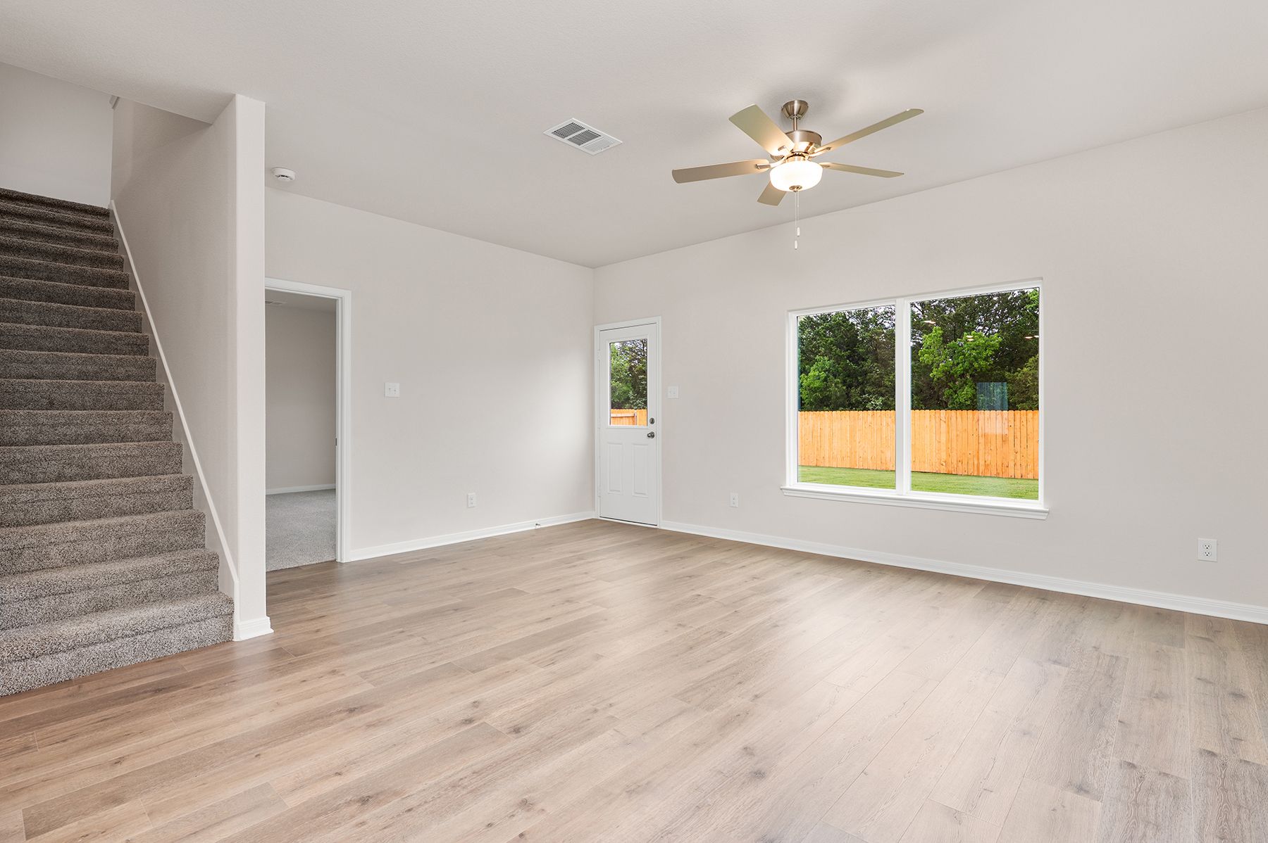 The family room of the Driftwood is spacious and has large windows.