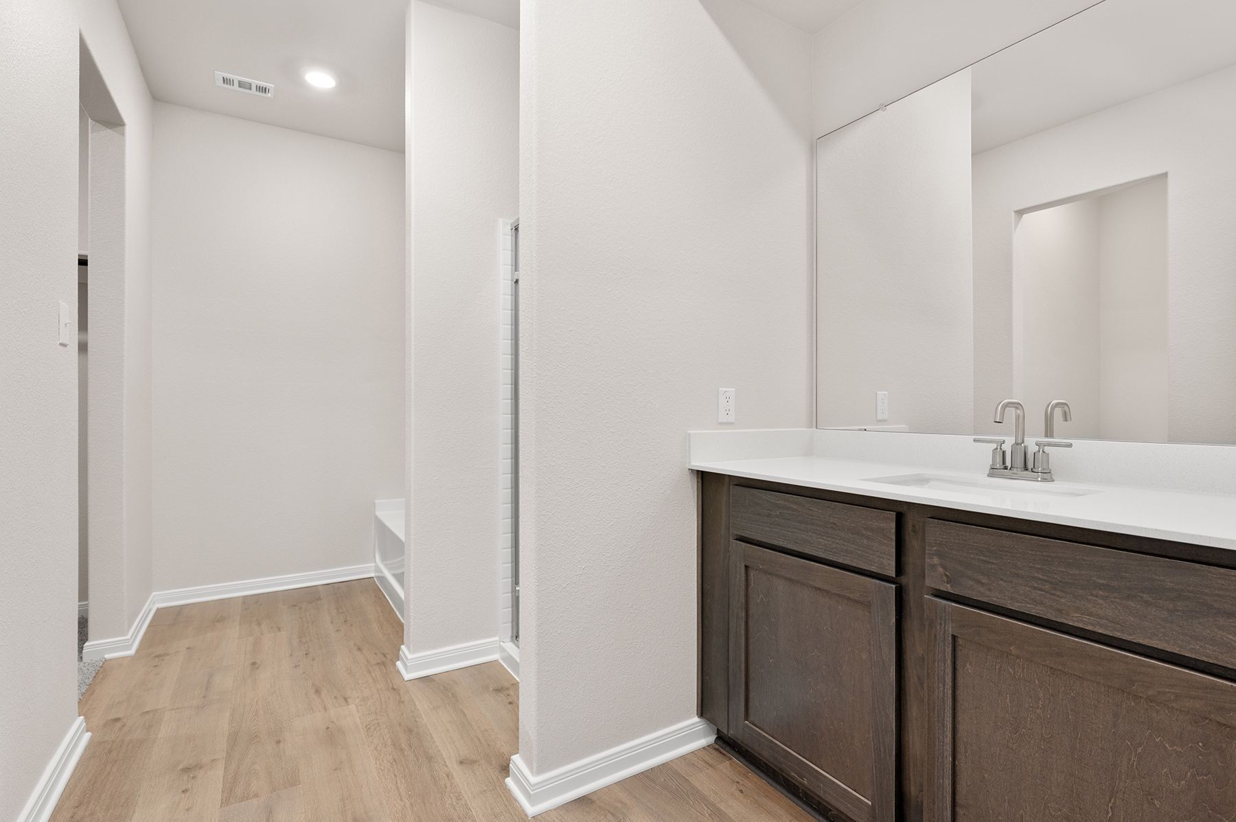 The master bathroom has a nice vanity space.