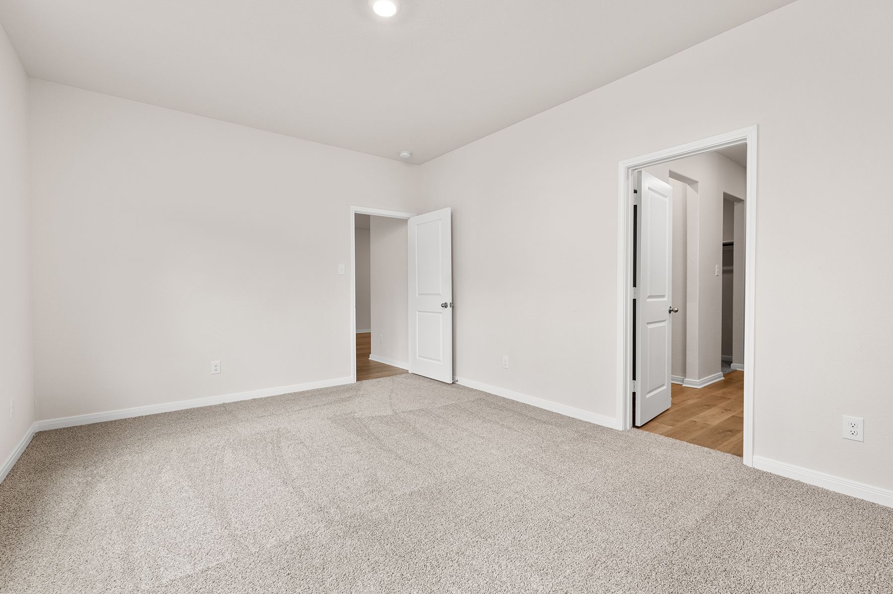 The master suite has a large bedroom, ensuite bathroom and walk-in closet.