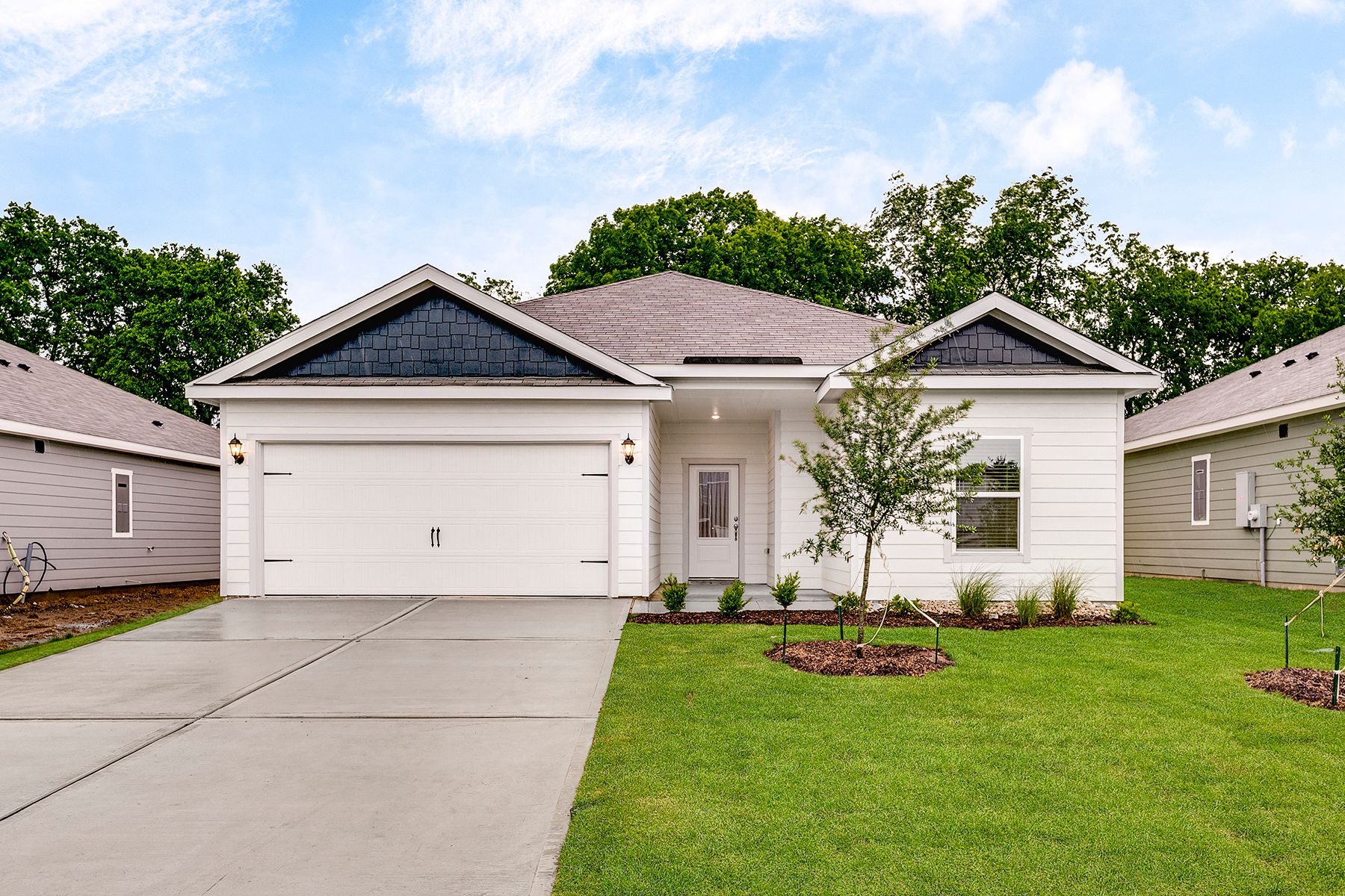 The Reed is a beautiful one-story, siding home.