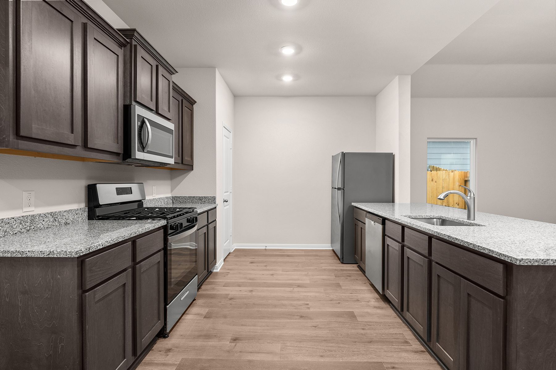 The kitchen of the Reed has gorgeous wood cabinetry.