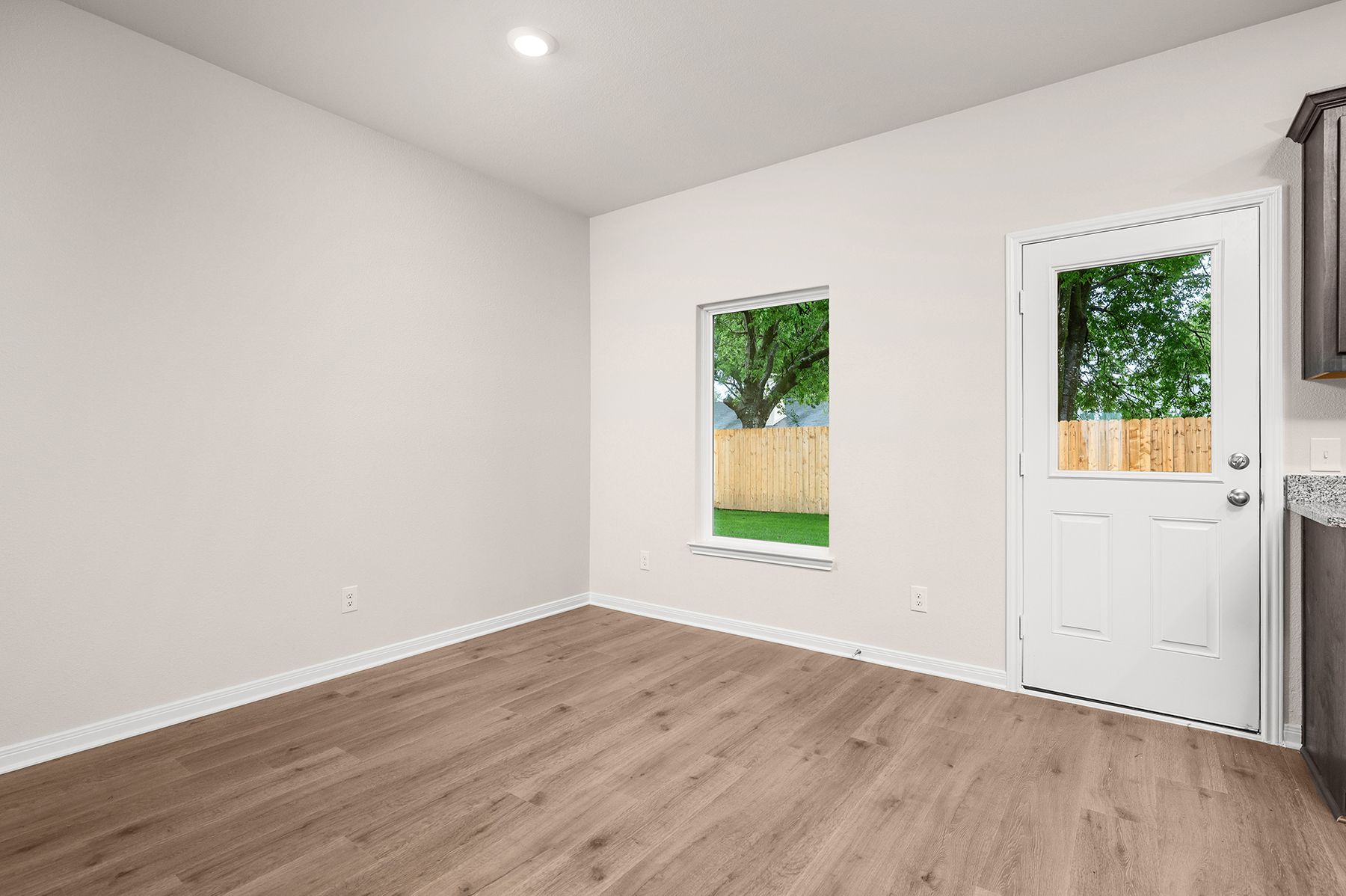 The dining room sits right off of the kitchen.