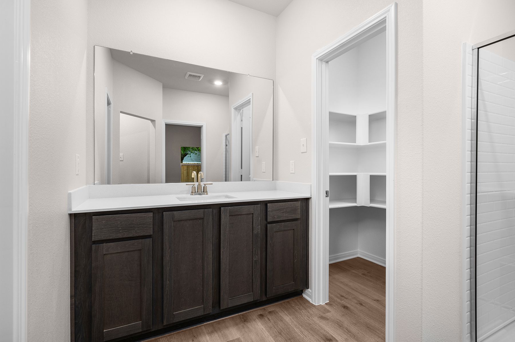 The master bathroom has a large vanity.