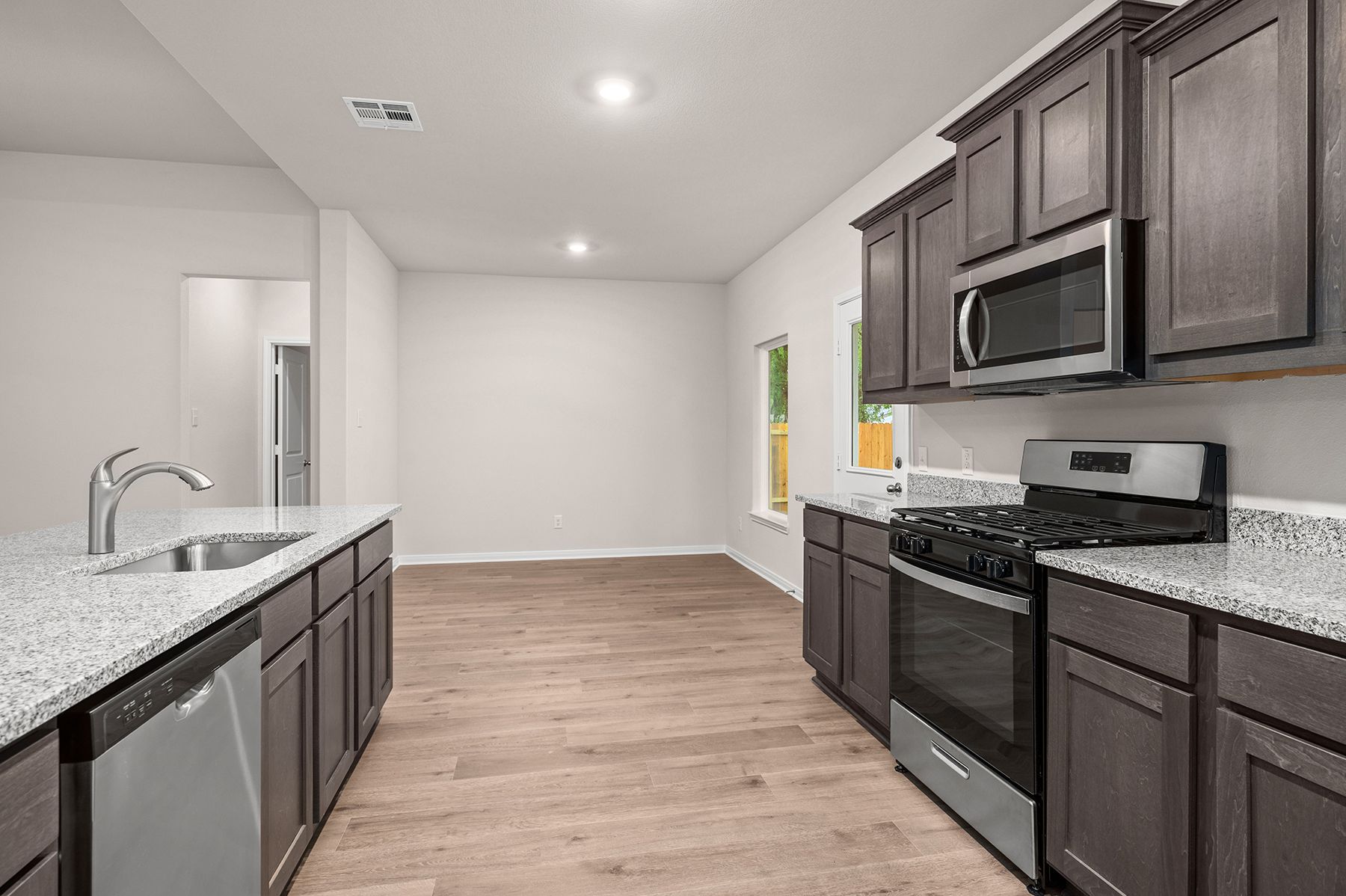 The kitchen of the Reed has sprawling granite countertops.