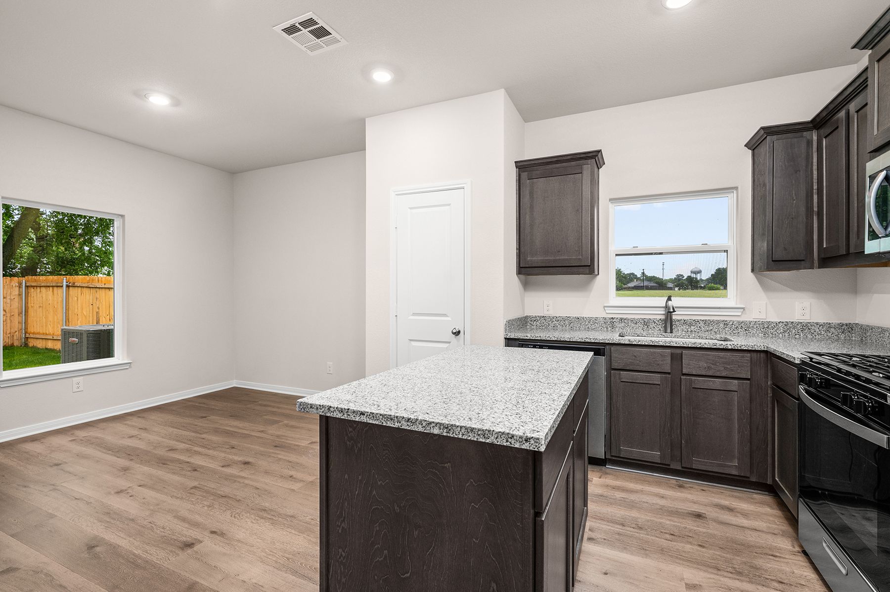 The kitchen of the Sabine has beautiful wood cabinetry.