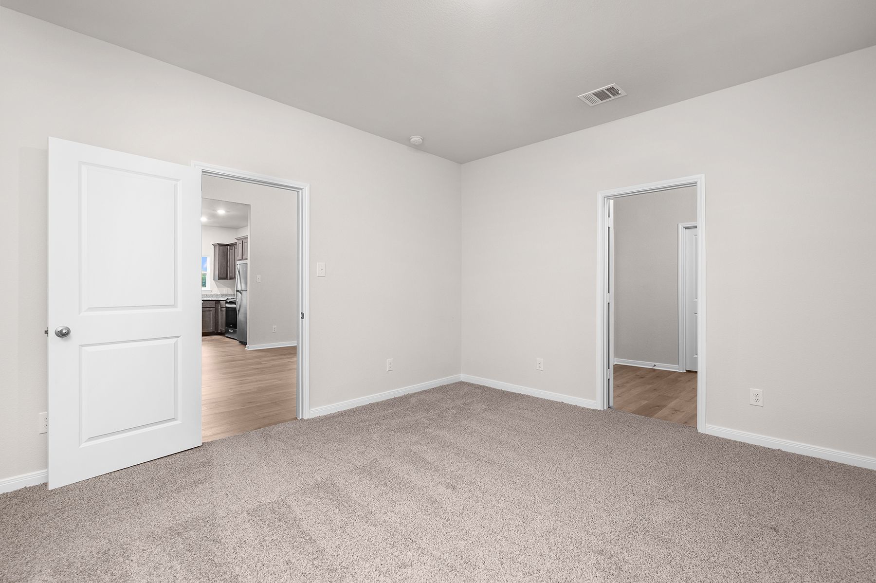 The master suite has a large bedroom, ensuite bathroom and walk-in closet.