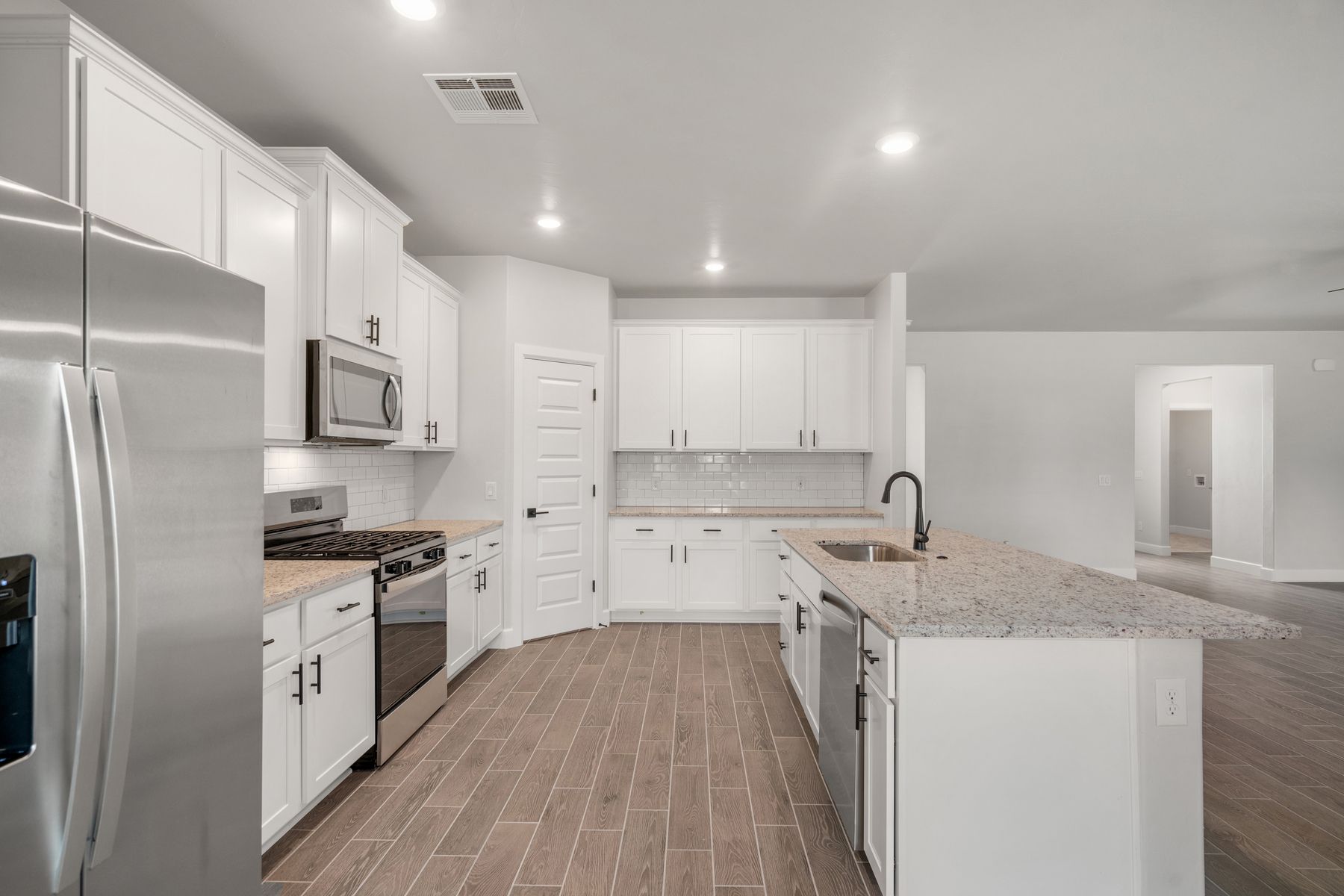 The kitchen has energy-efficient, stainless-steel appliances.