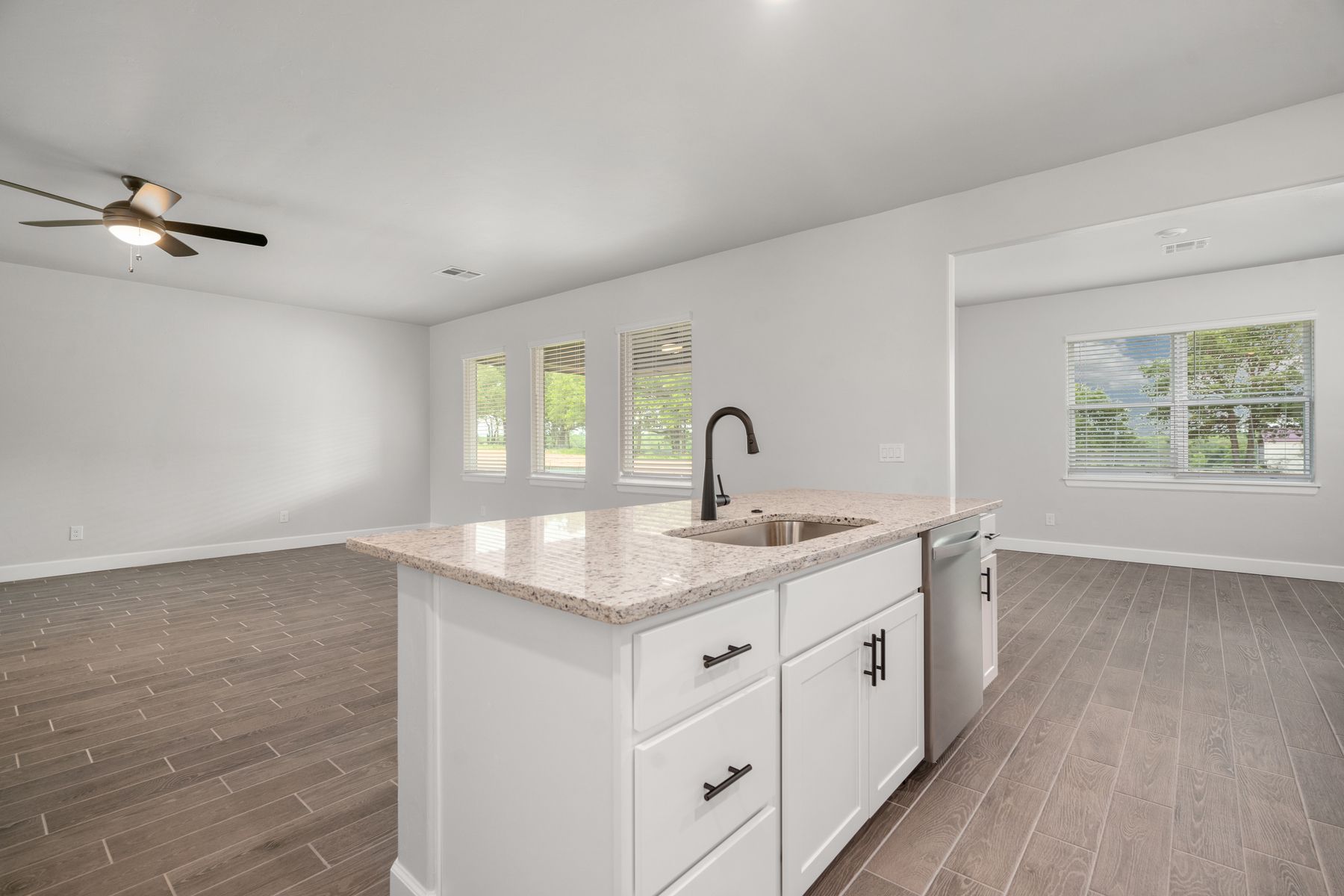 The kitchen looks over in the family room.