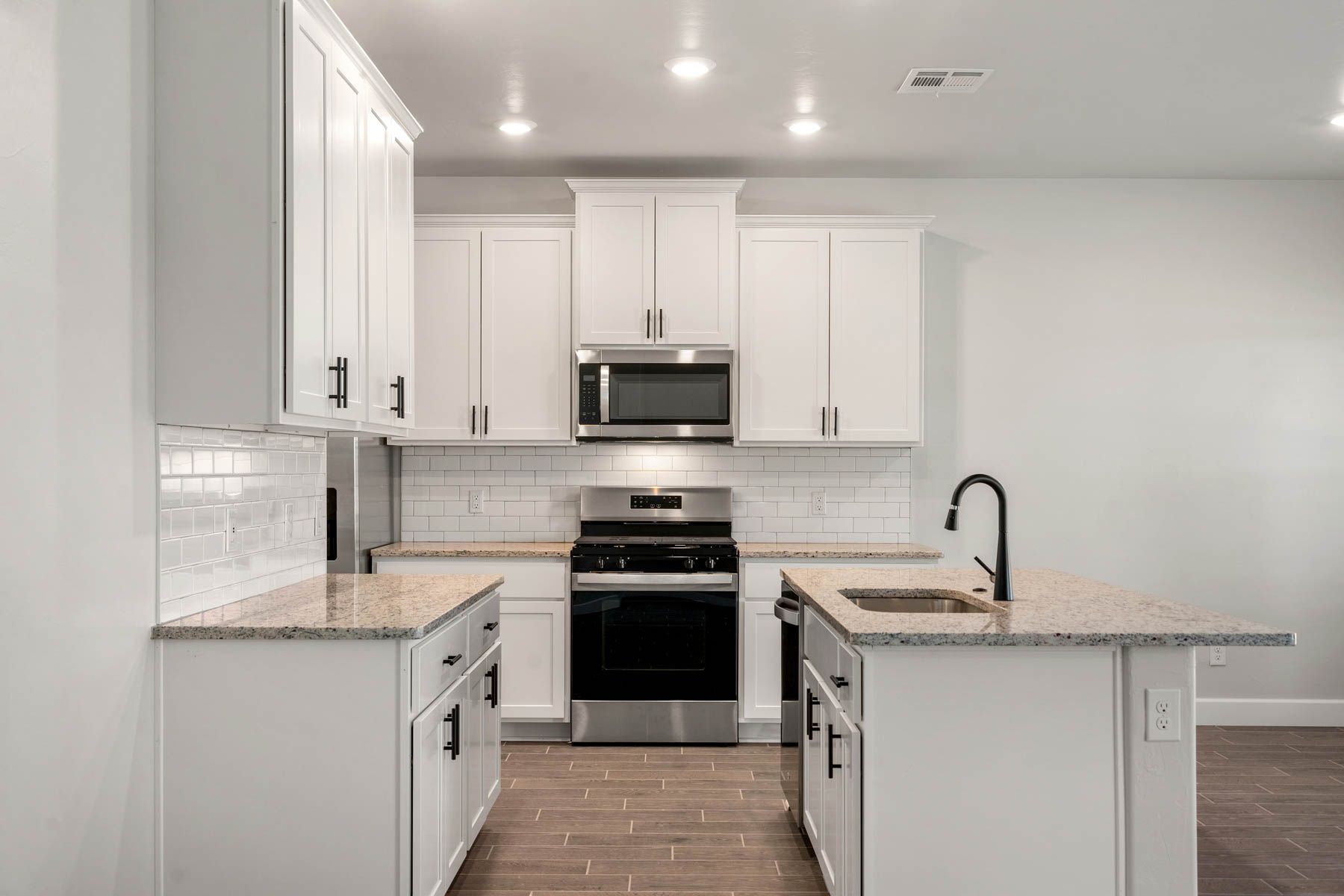 The kitchen has energy-efficient, stainless-steel appliances.