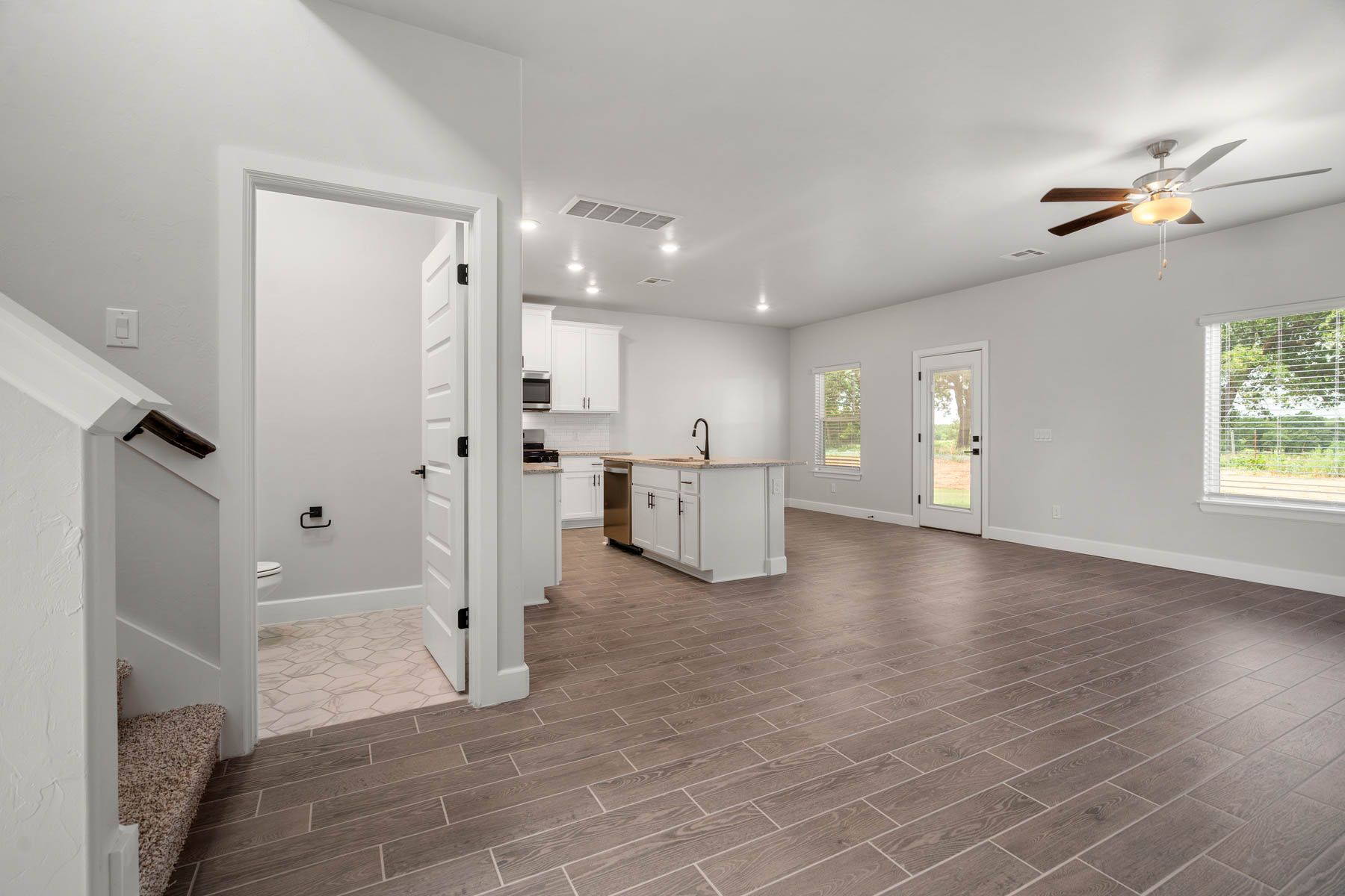 The powder room sits right off of the family room.