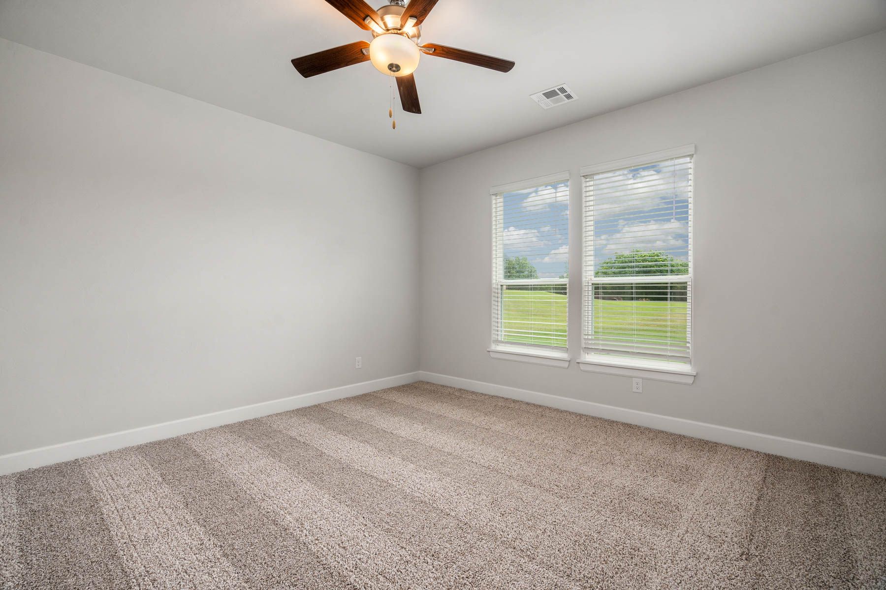 The master bedroom has a large window that lets in great, natural light.