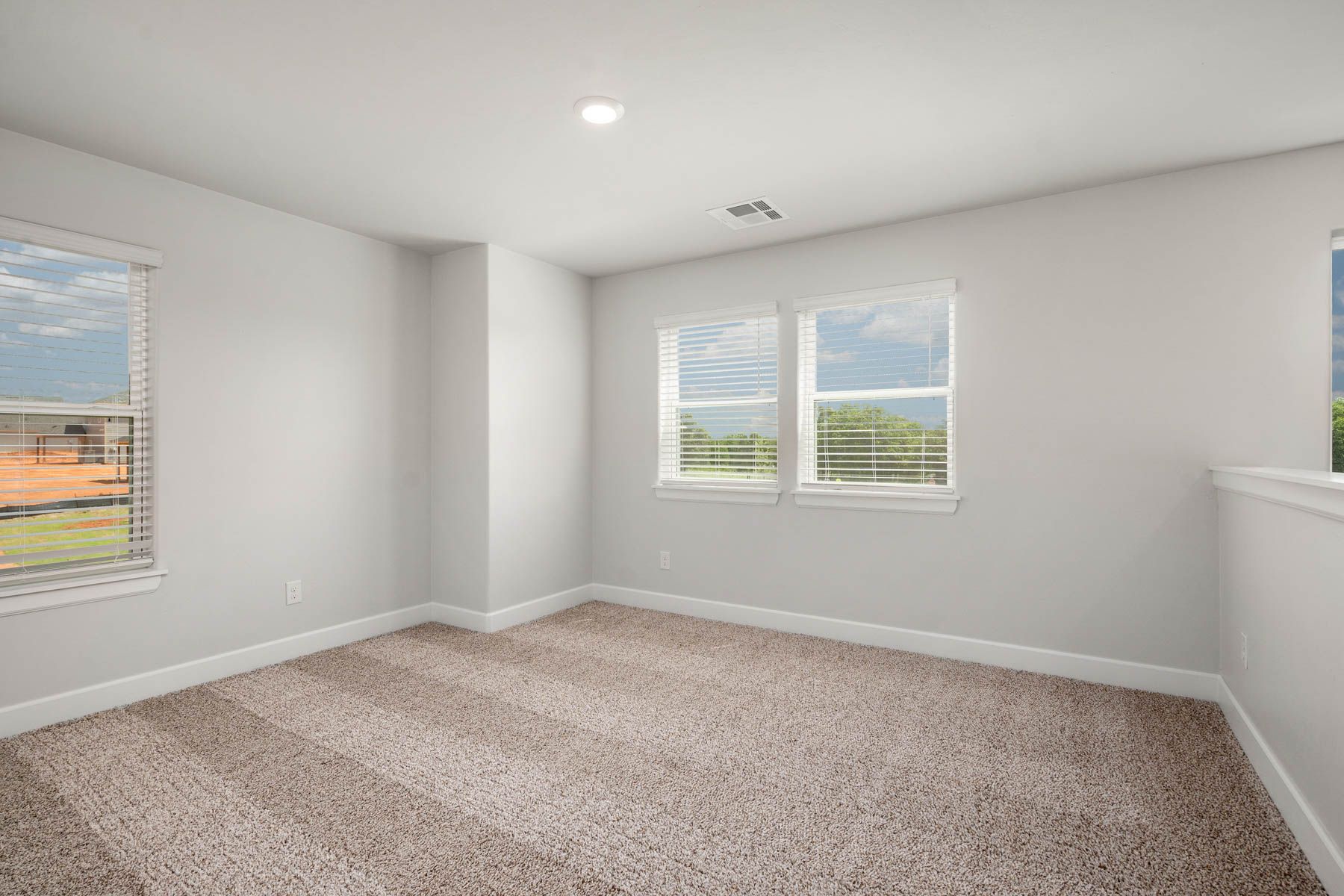 The upstairs loft is a versatile space with lots of windows.