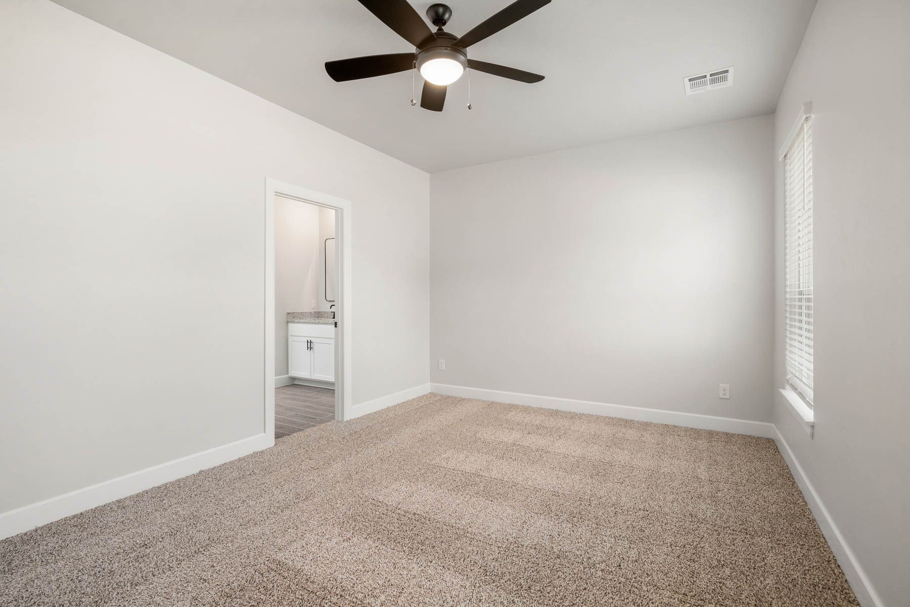 The master suite has a large bedroom, en-suite bathroom and walk-in closet.