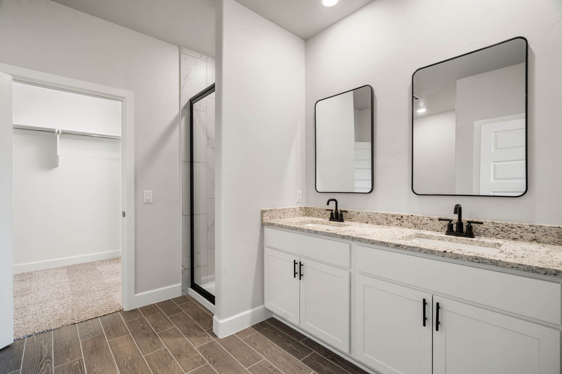 The master bathroom has a large vanity space.