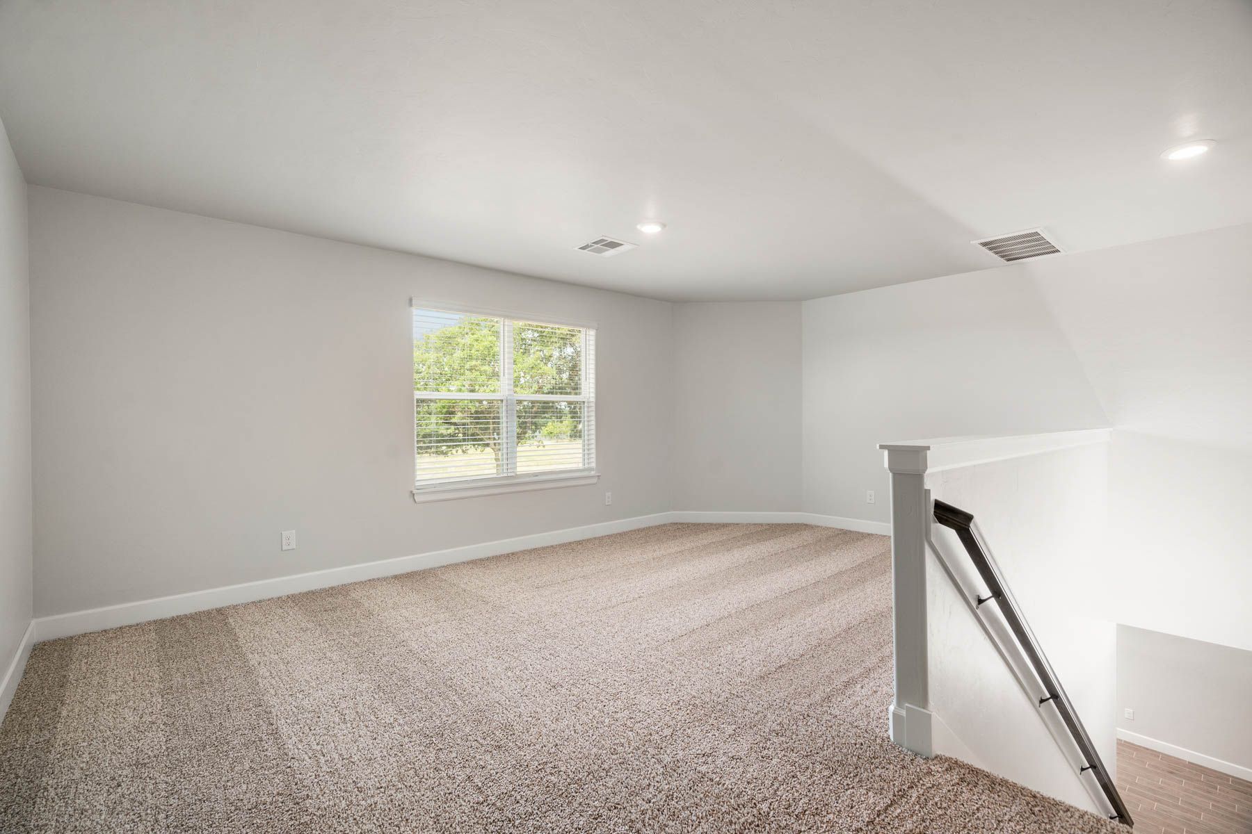 Upstairs, there is a spacious gameroom loft.
