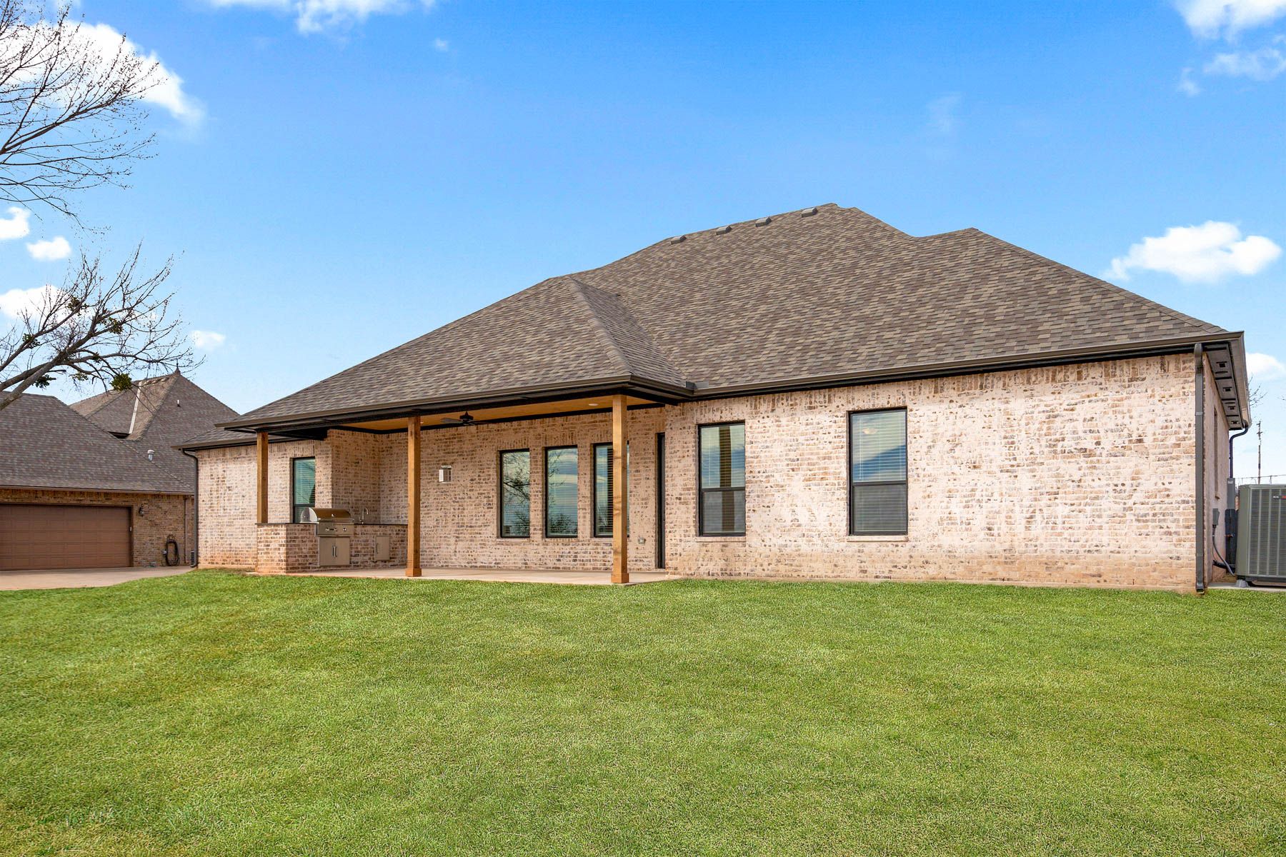 The Hefner has a covered back patio with an outdoor kitchen.