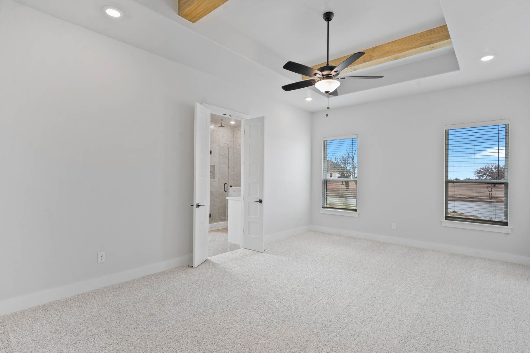 The master suite has a large bedroom, en-suite bathroom and walk-in closet.