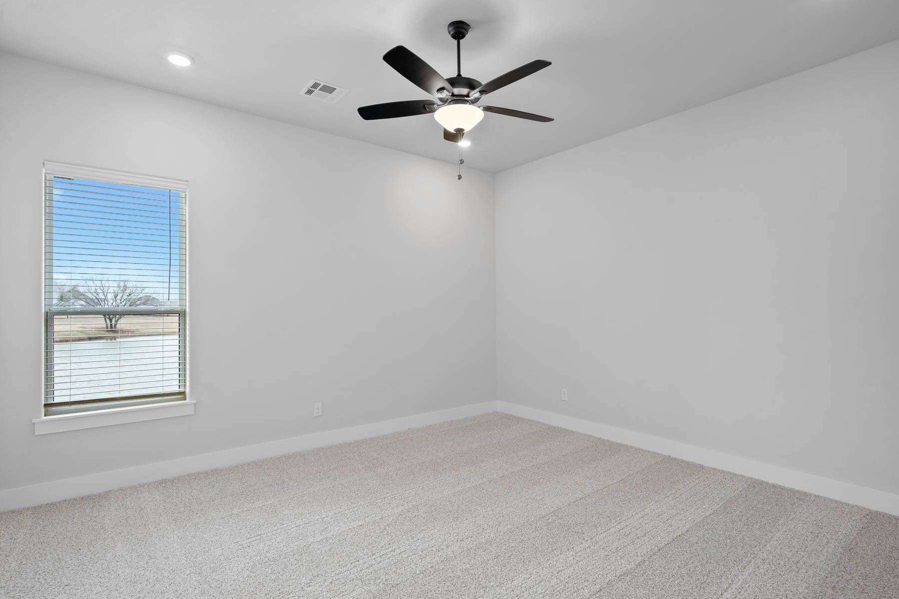 The spacious master closet has plenty of hanging and shelf space.