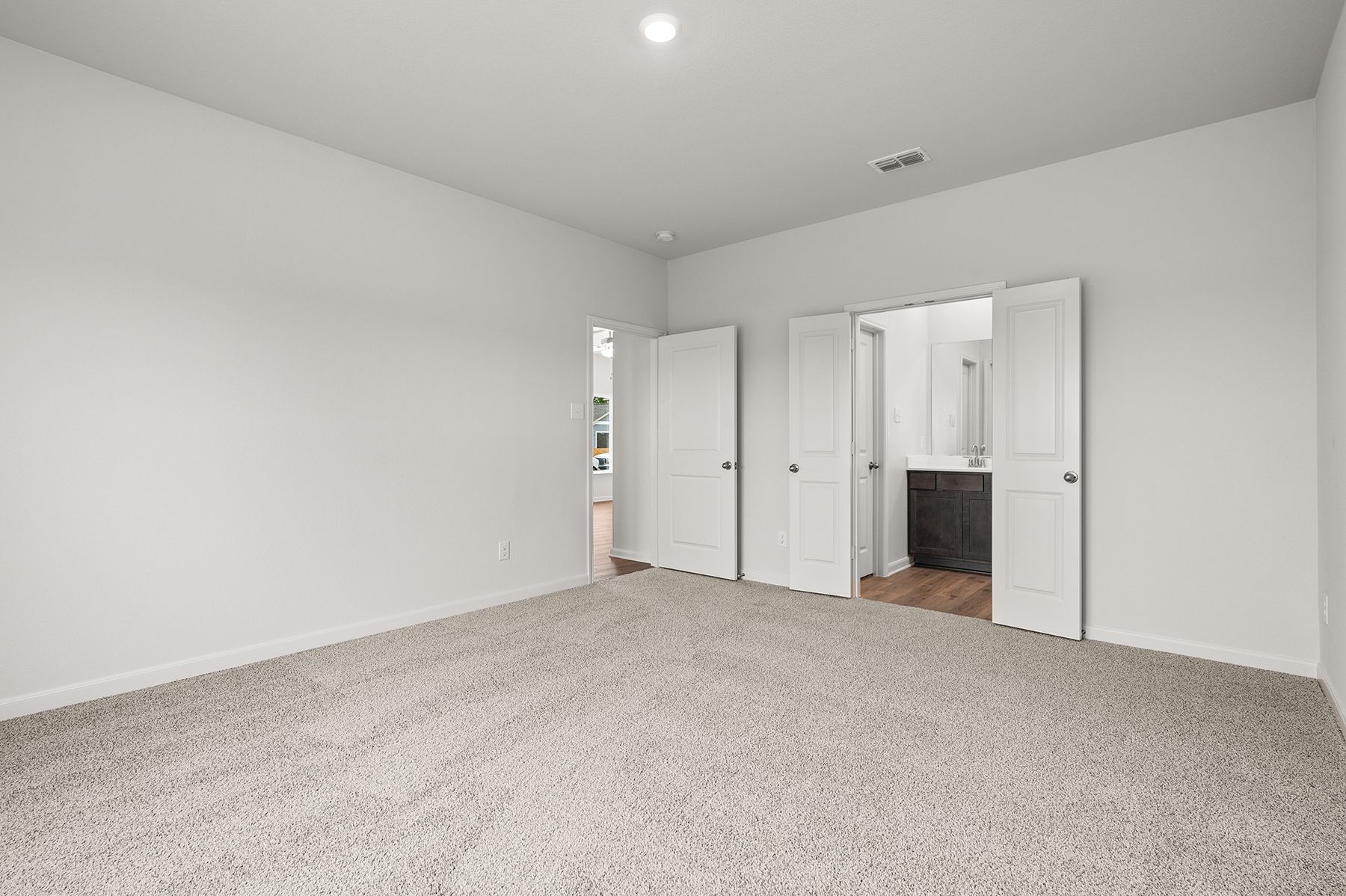 The master suite has a large bedroom, ensuite bathroom and walk-in closet.