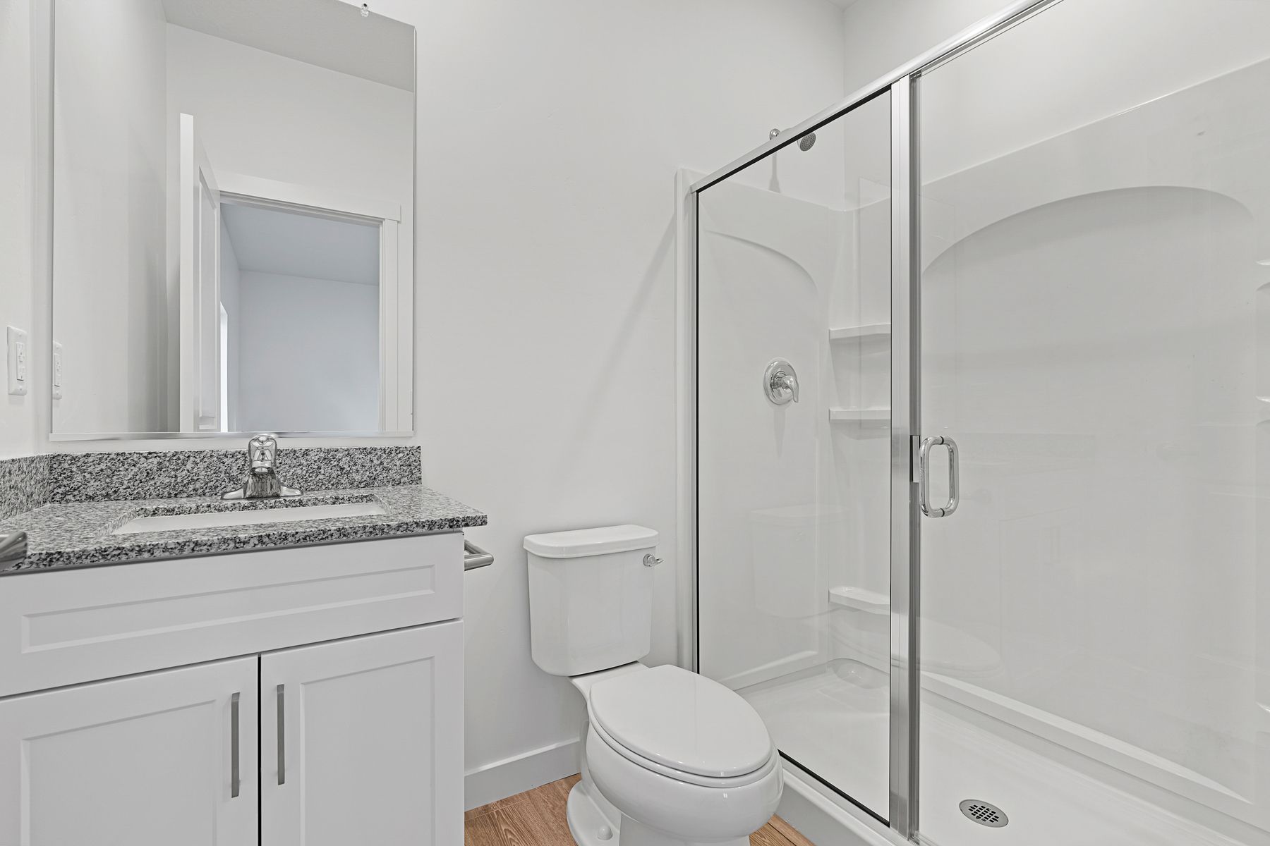 The master bathroom comes equipped with a beautiful walk-in shower