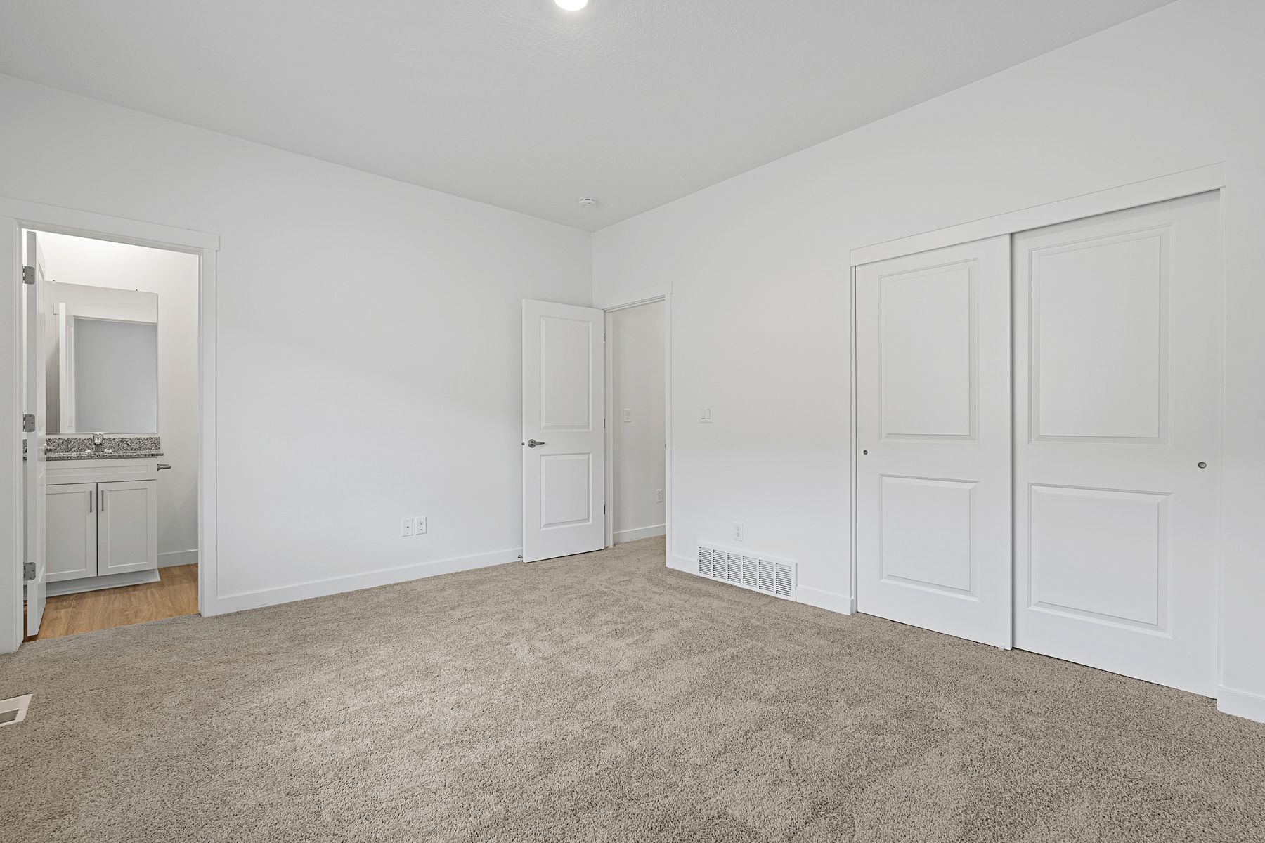 The master suite has a large bedroom and ensuite bathroom.