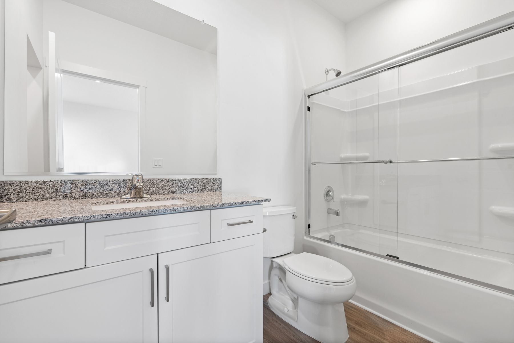 The gorgeous master bathroom includes a dual bathtub and shower as well as a walk-in closet