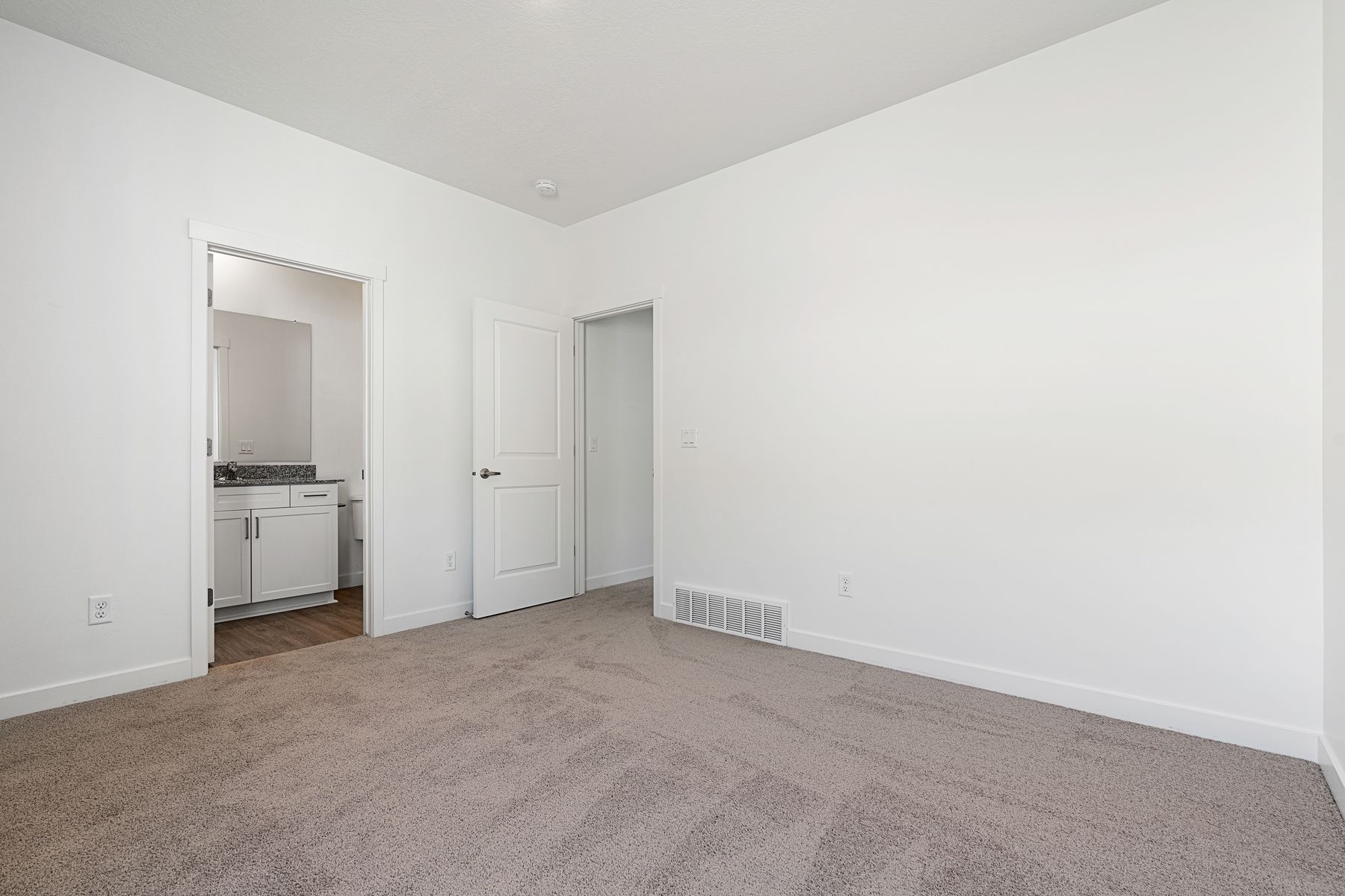 The master suite has a spacious bedroom, en-suite bathroom and large walk-in closet. 