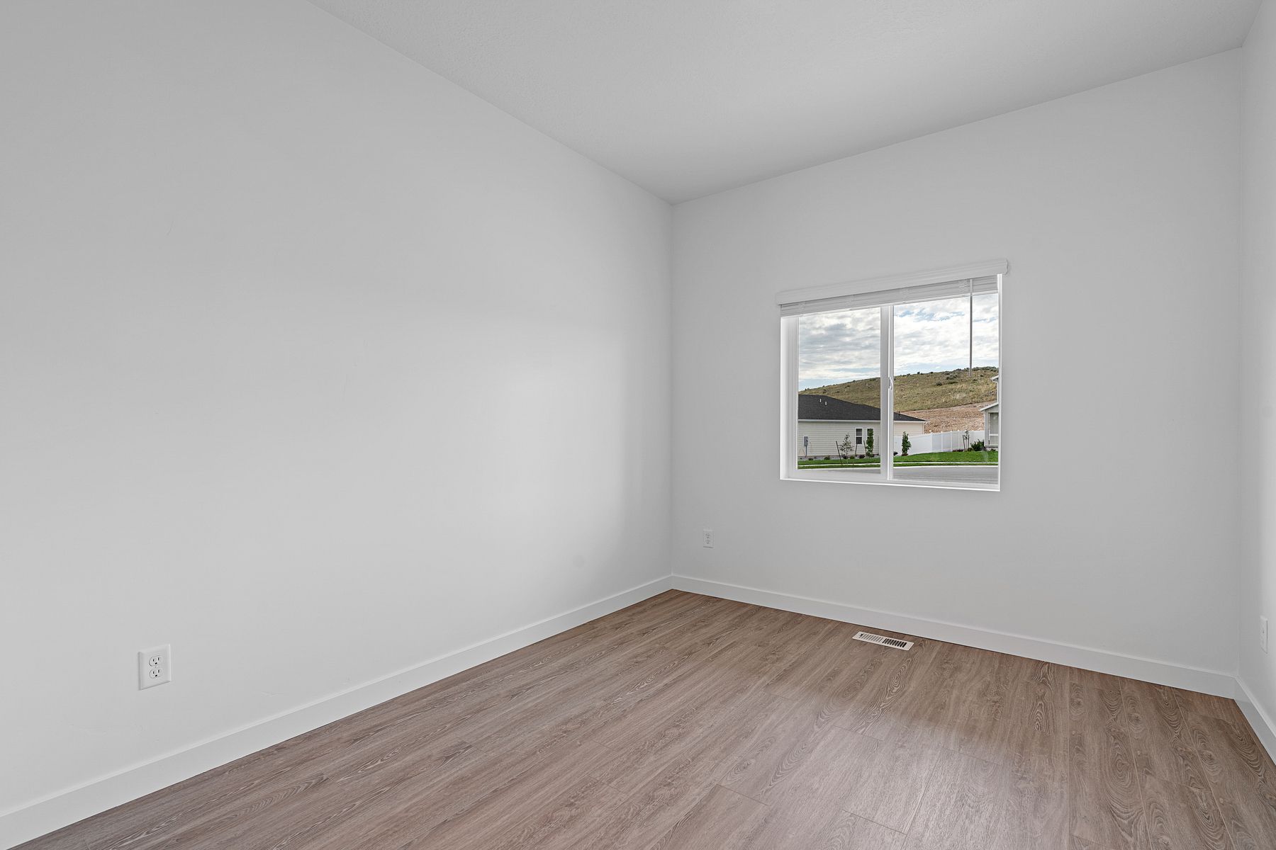 The formal dining room has a large window that lets in great, natural light. 