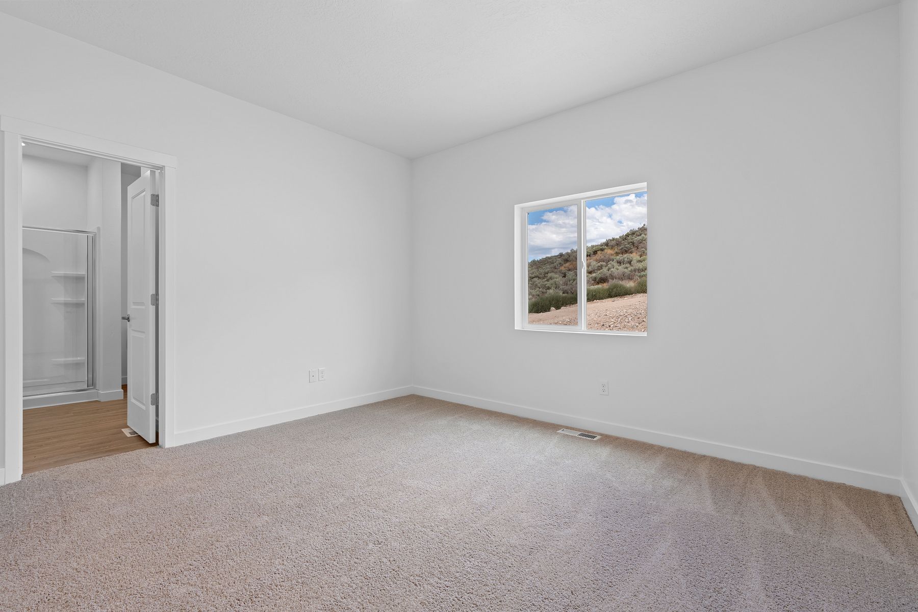 The spacious master suite has gorgeous amounts of bright, natural light