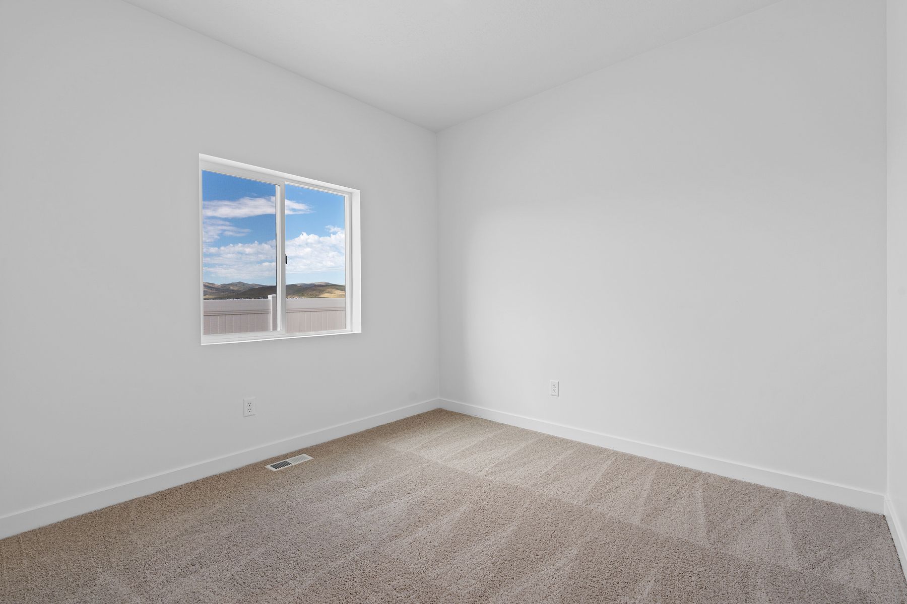 The Glenwood's other rooms include tan carpets, closets and charming windows