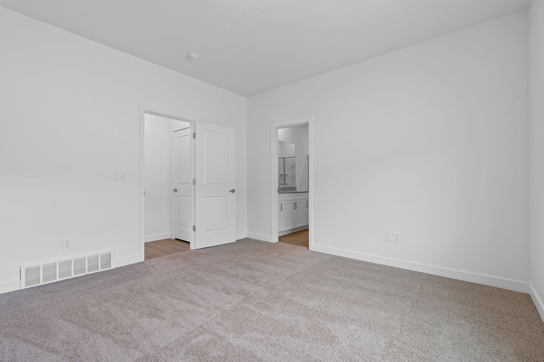 The master suite has a large bedroom. ensuite bathroom and walk-in closet.