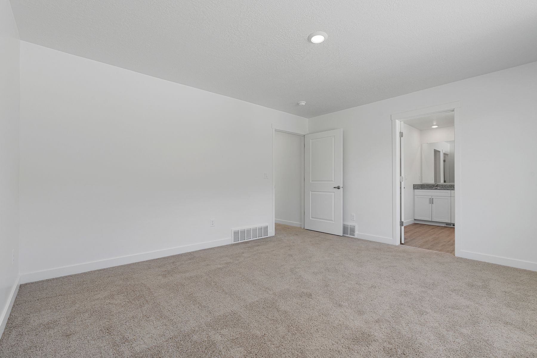 The master suite has a large bedroom, ensuite bathroom and walk-in closet. 