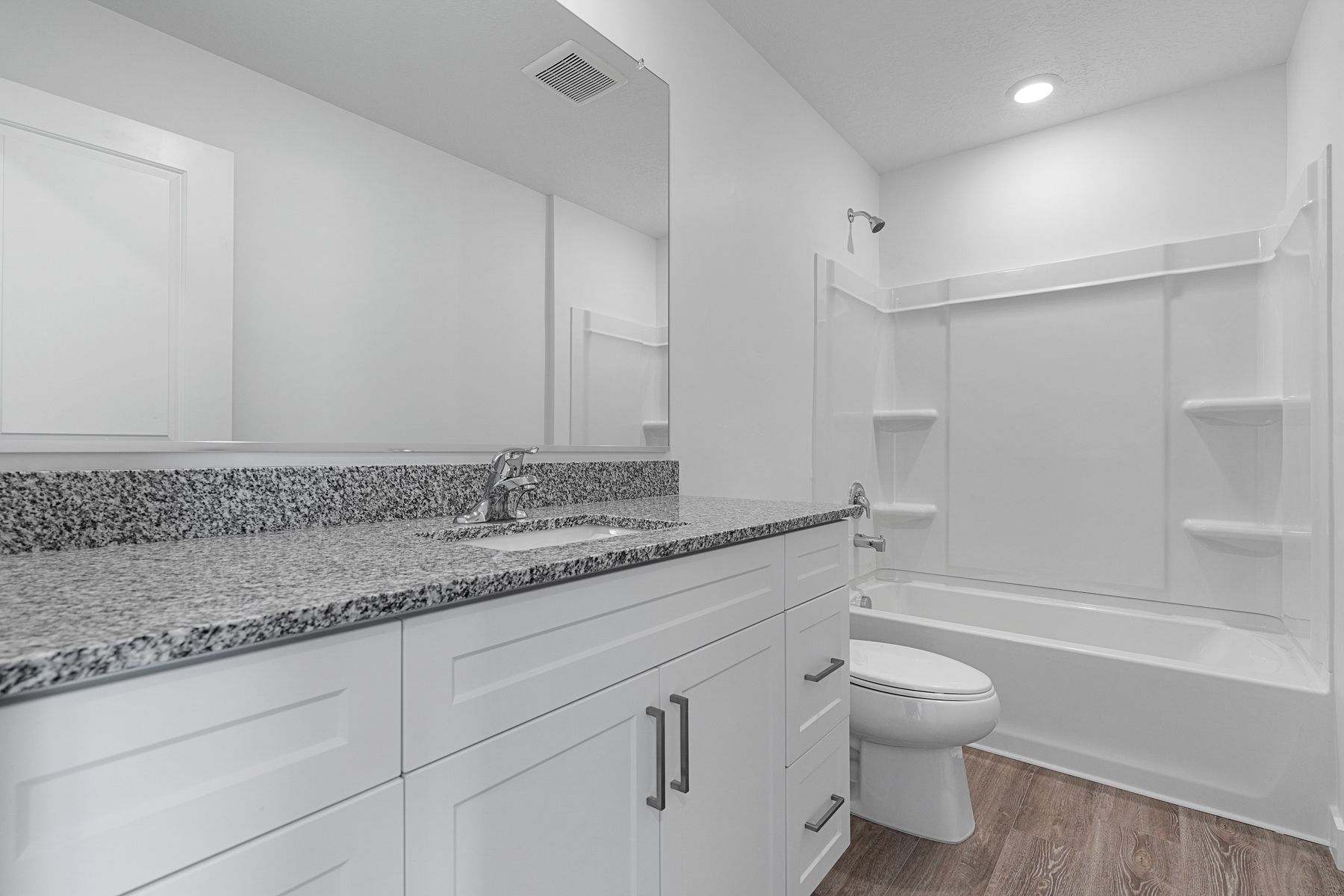 The two secondary bathrooms have large vanity spaces and a shower-tub combo.