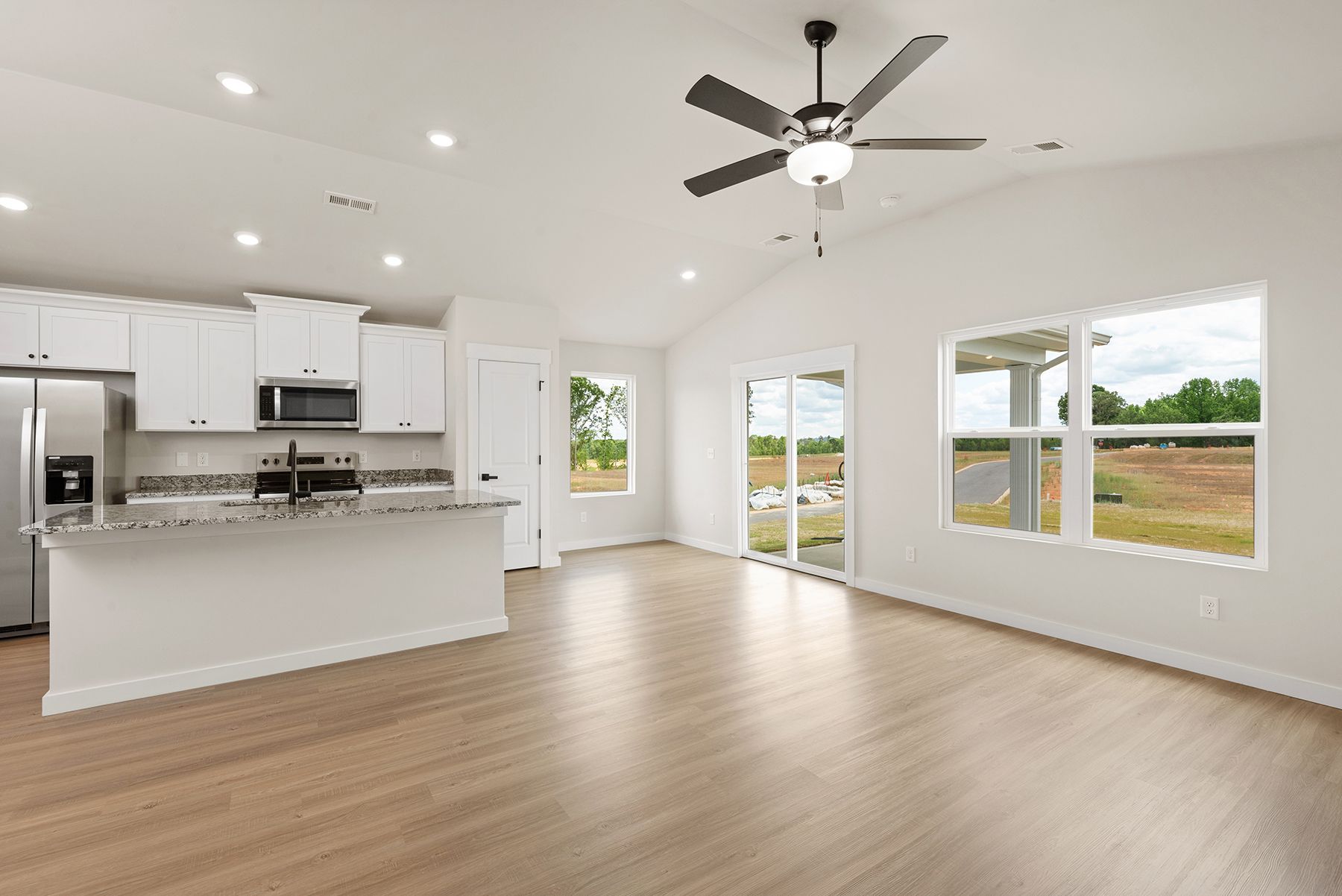 The kitchen has designer wood cabinetry