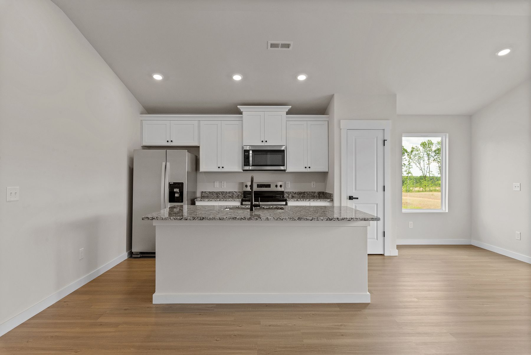 The kitchen has lots of natural light